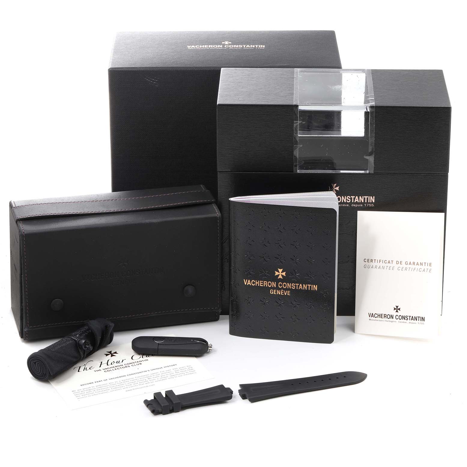 The image shows Vacheron Constantin Overseas 47450/000W-9511 Men's Stainless Steel Grey Dial 47450/000W-9511 Men's Stainless Steel Grey Dial model watch accessories, including box, travel case, strap, booklets, and certificates.