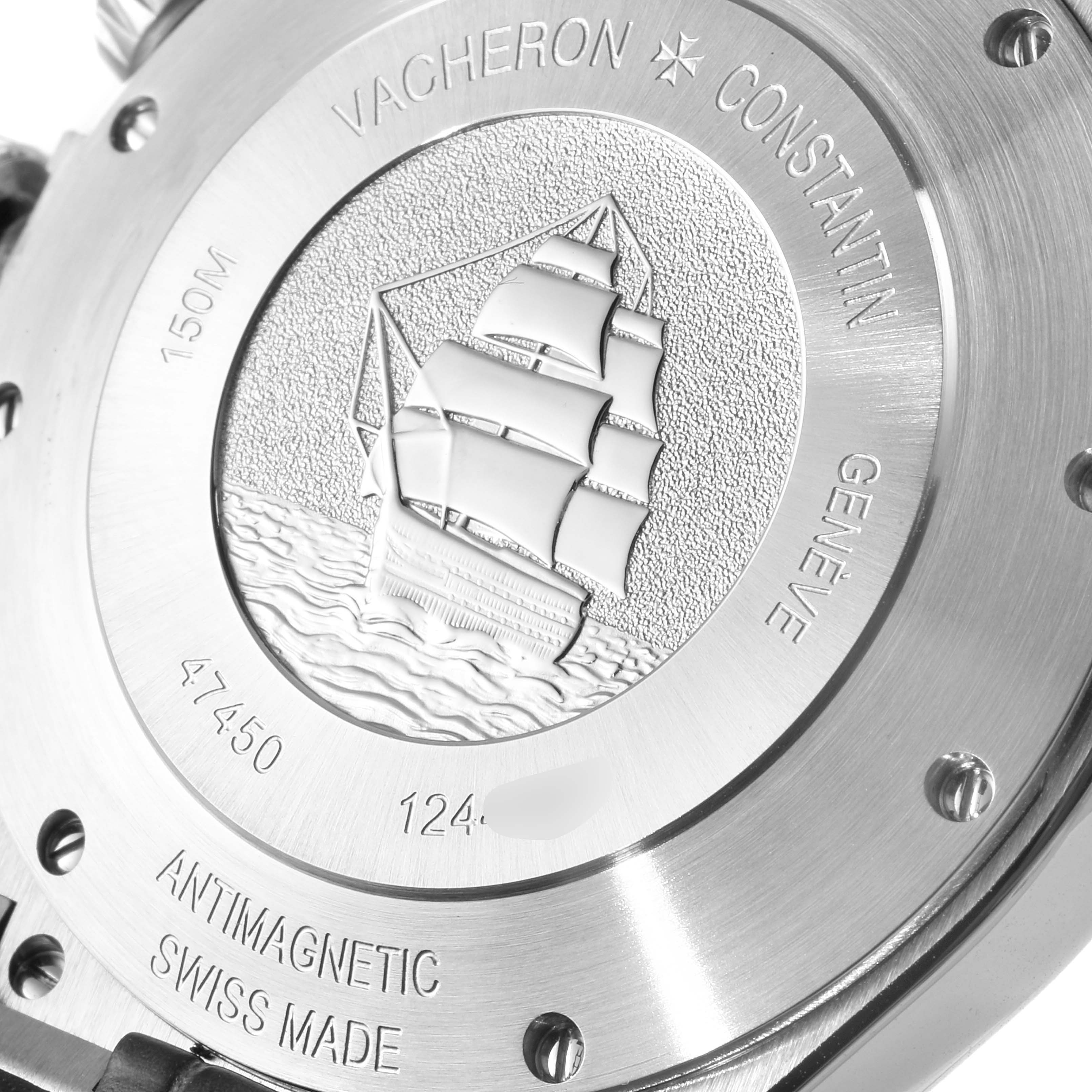 The image shows the engraved case back of a Vacheron Constantin Overseas 47450/000W-9511 Men's Stainless Steel Grey Dial 47450/000W-9511 Men's Stainless Steel Grey Dial watch, featuring a sailing ship design.