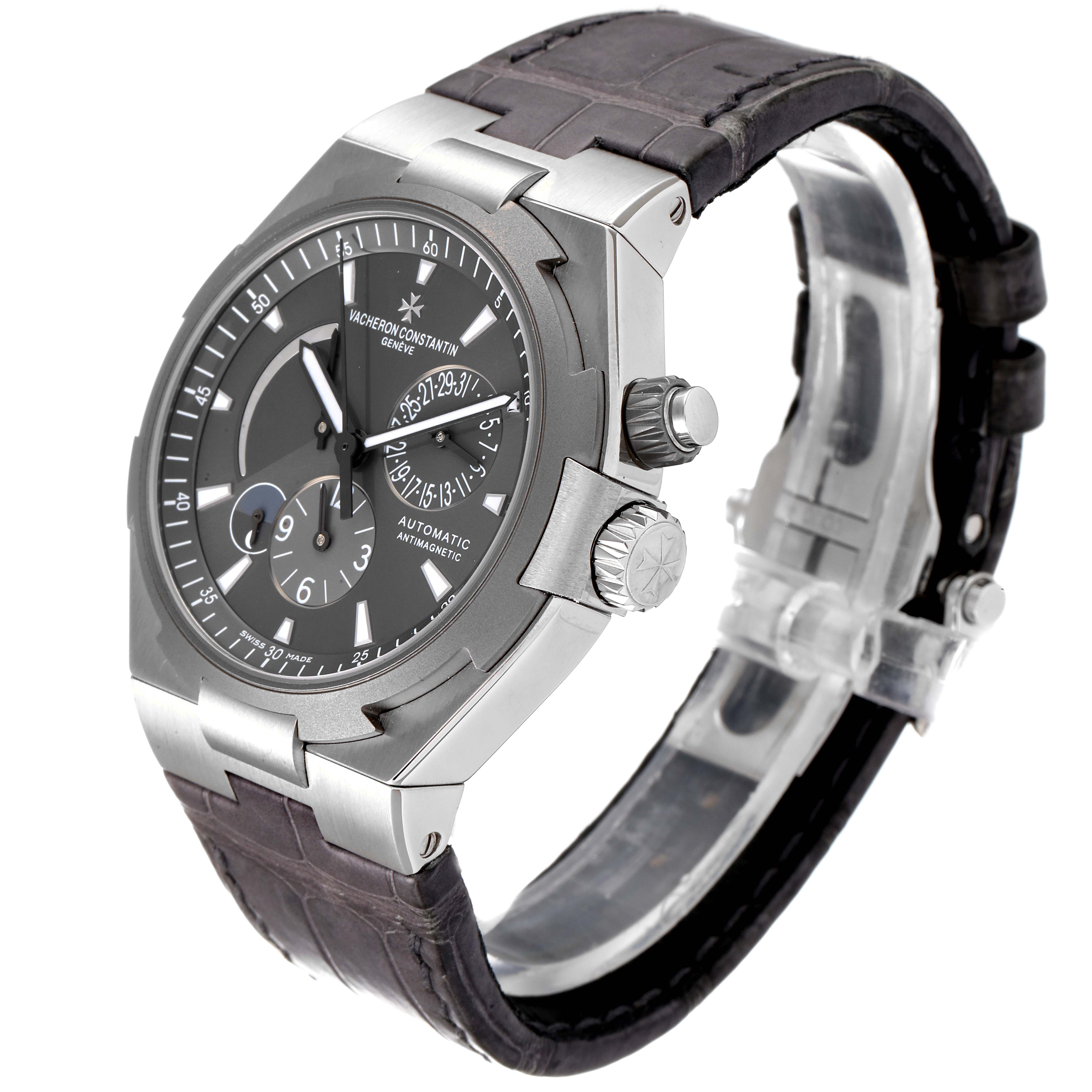 The image shows a Vacheron Constantin Overseas 47450/000W-9511 Men's Stainless Steel Grey Dial 47450/000W-9511 Men's Stainless Steel Grey Dial watch at an angled front view, highlighting its dial, crown, and strap.