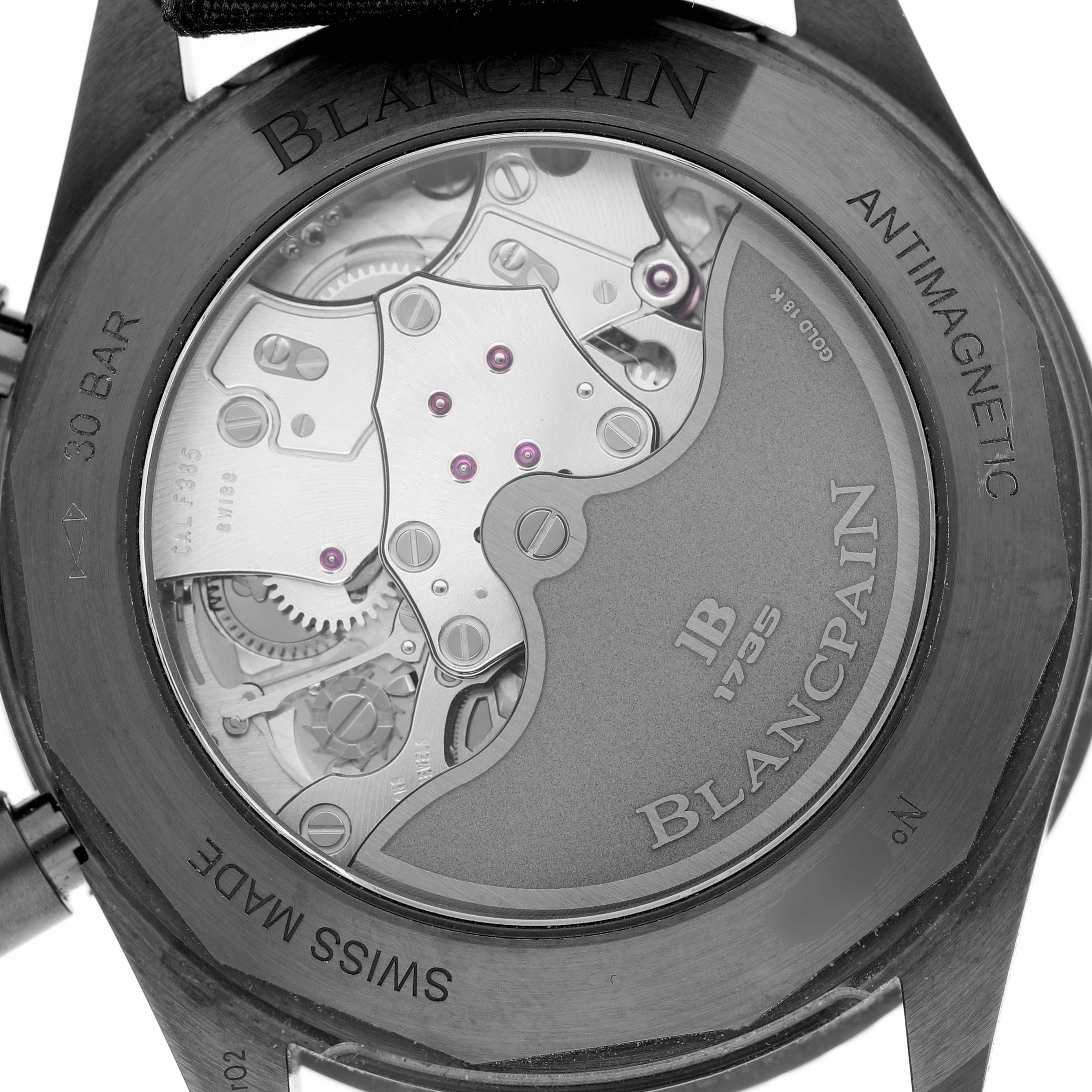 The image shows the back view of a Blancpain Fifty Fathoms 5200-0130-NABA Men's Ceramic Black Dial watch, revealing its intricate mechanical movement.