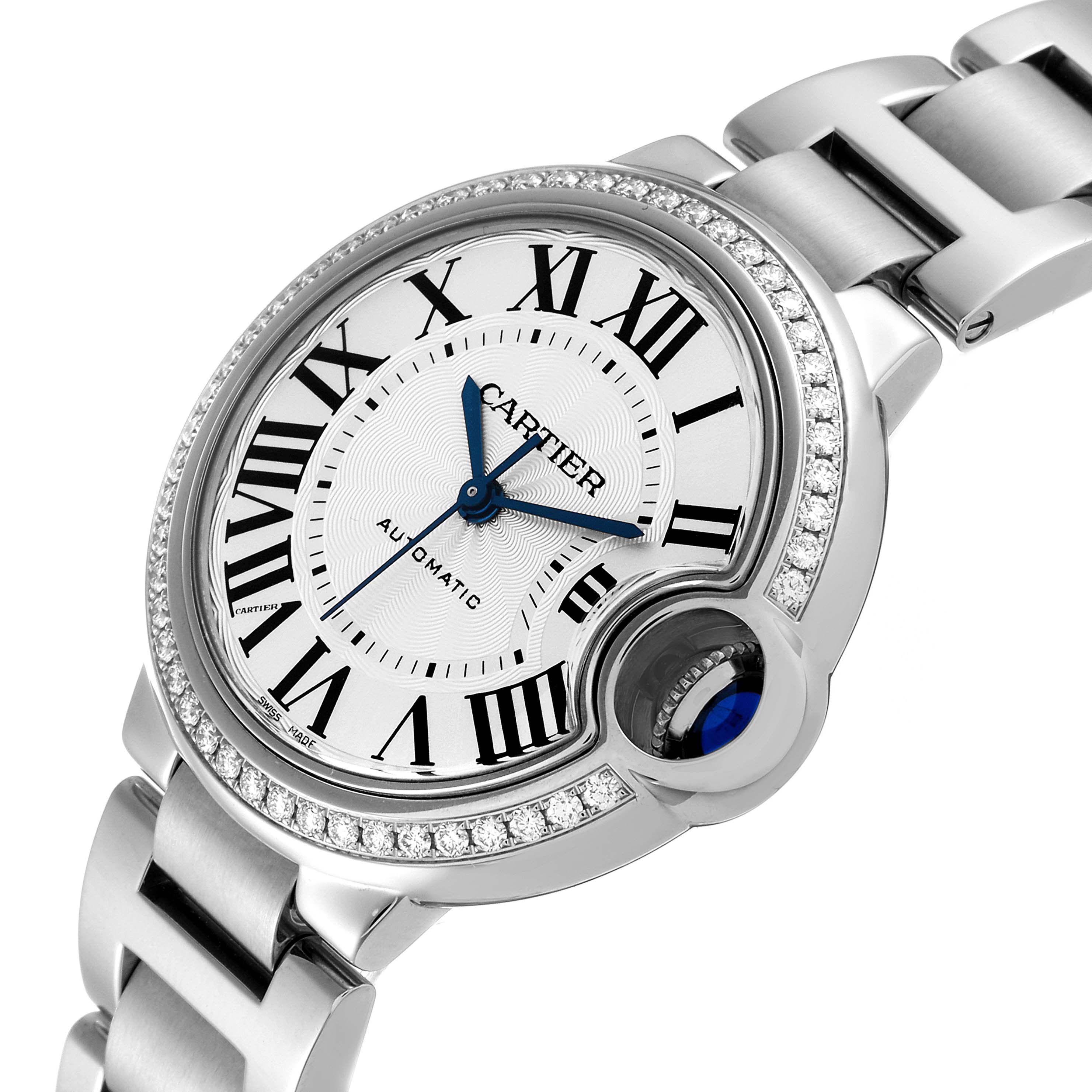 The image shows a close-up view of the Cartier Ballon Bleu W4BB0016 Women
s Stainless Steel Silver Dial W4BB0016 Women
s Stainless Steel Silver Dial watch, highlighting its face, Roman numerals, blue hands, and part of the bracelet.