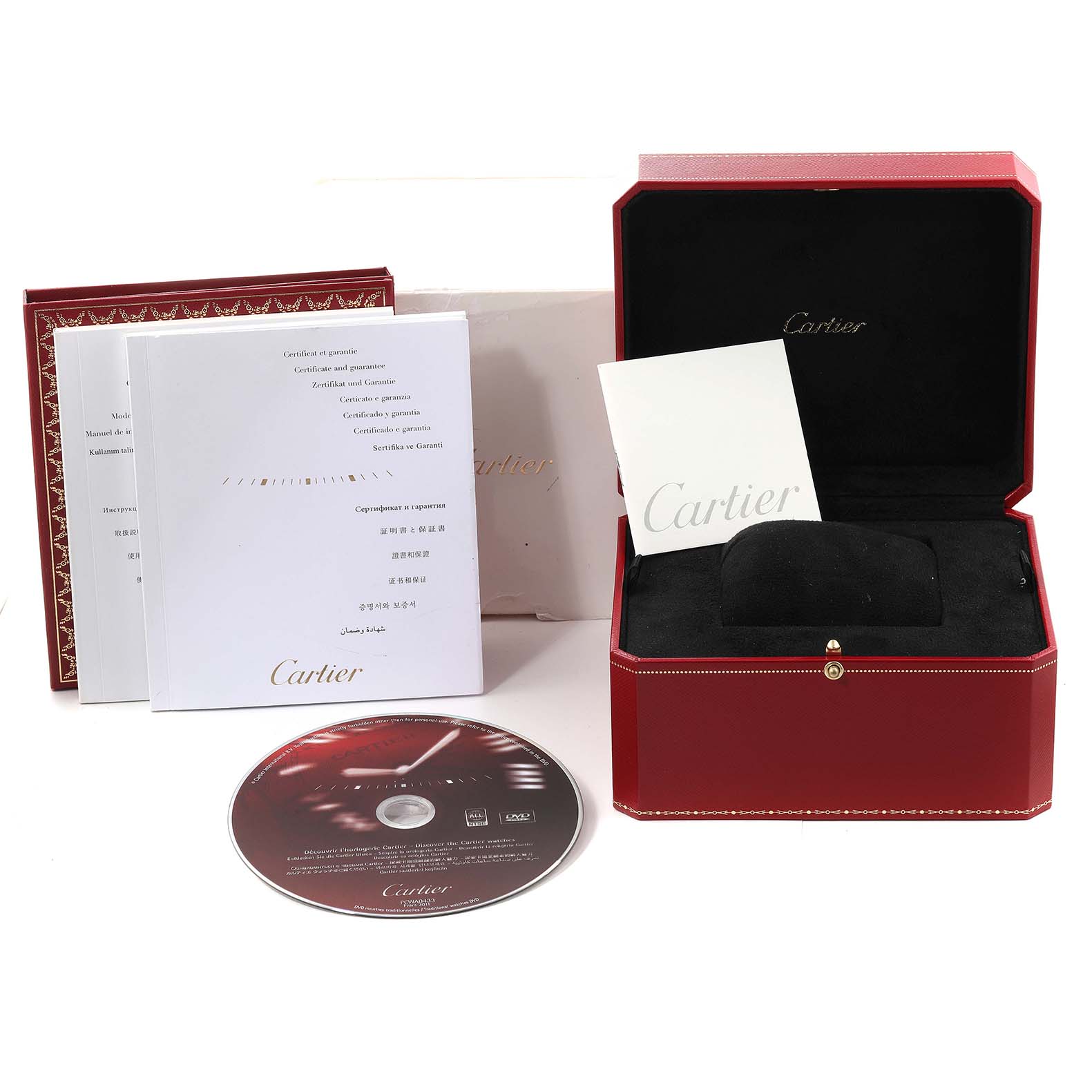 The image shows a Cartier Calibre de Cartier W7100042 Men's Steel and Gold (two tone) Silver Dial W7100042 Men's Steel and Gold (two tone) Silver Dial watch box, manuals, certificates, and a CD, viewed from a front angle.