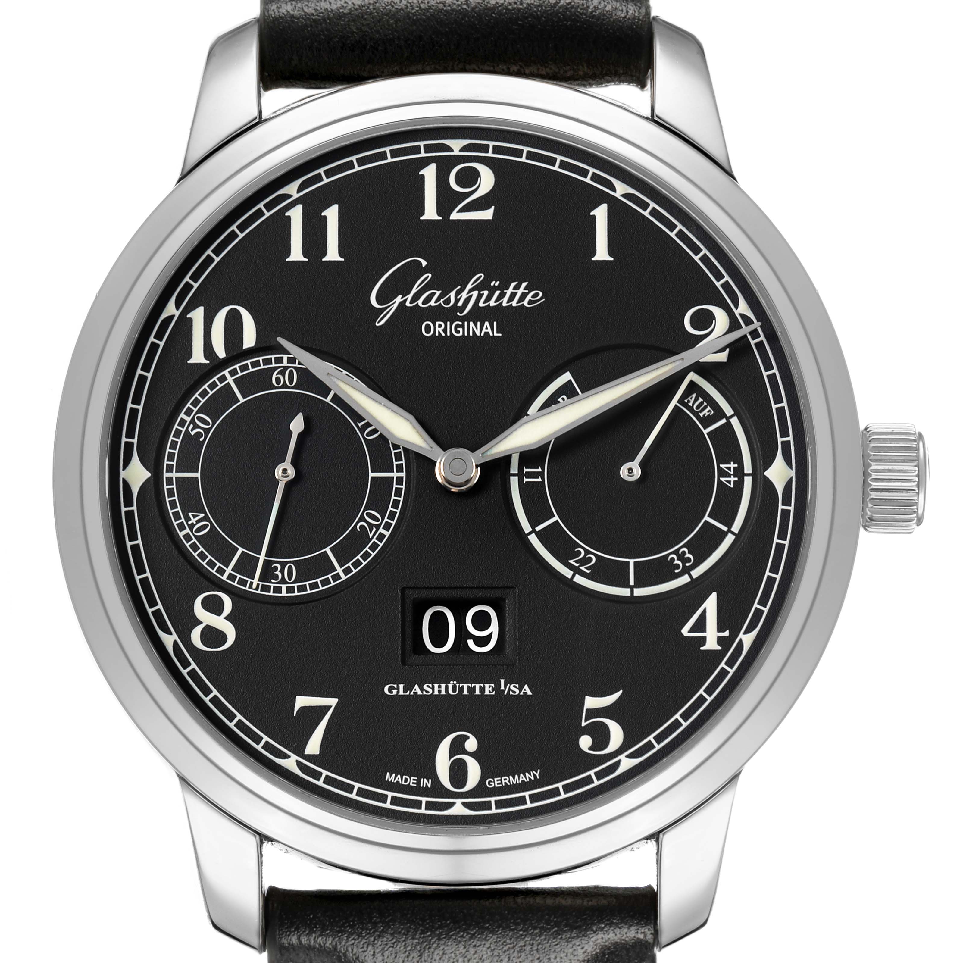 The Glashütte Senator watch is shown from the front, highlighting the black dial, subdials, and large date display.