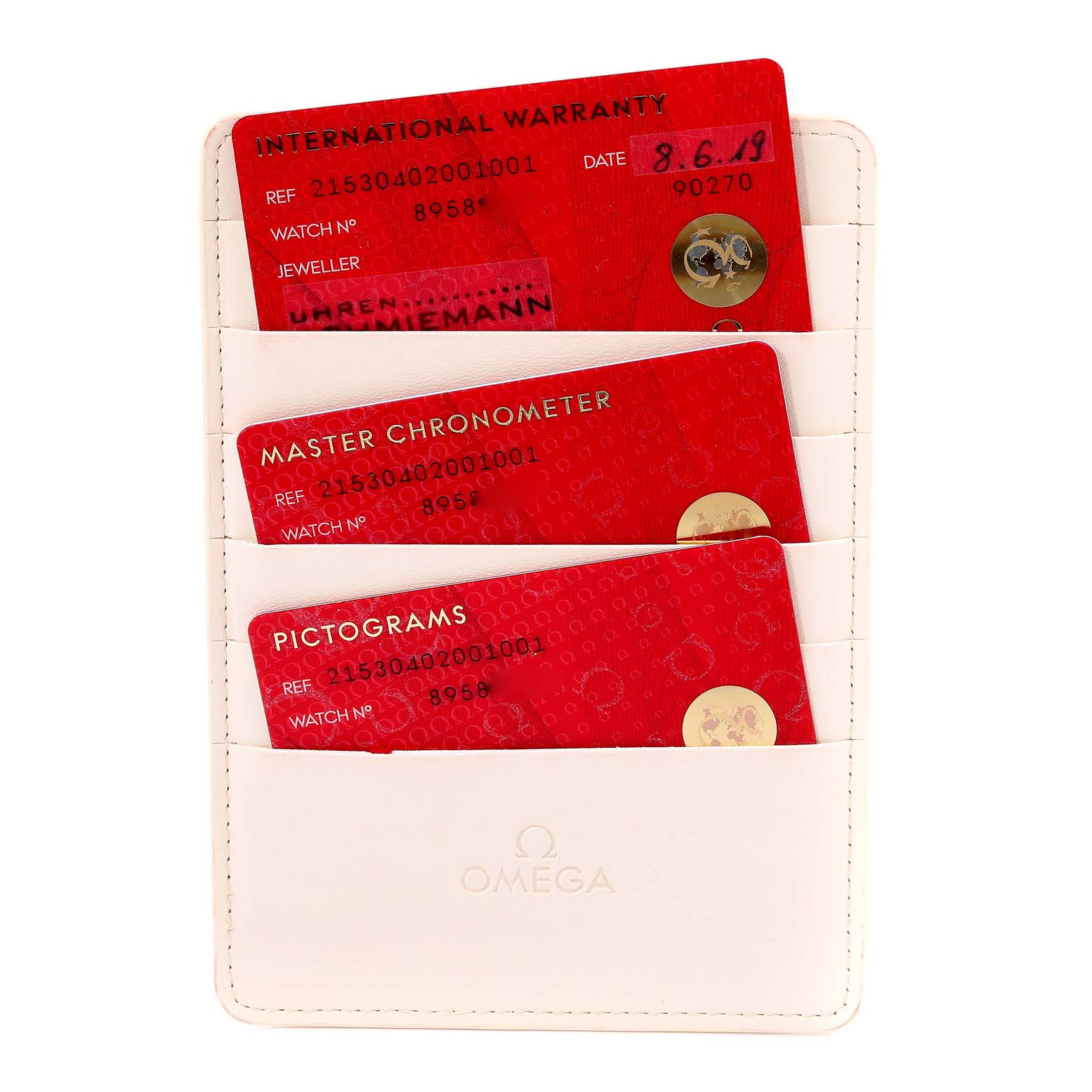 This image shows three red cards for an Omega Planet Ocean 215.30.40.20.01.001 Men
s Stainless Steel Black Dial 215.30.40.20.01.001 Men
s Stainless Steel Black Dial watch, including International Warranty, Master Chronometer, and Pictograms cards.