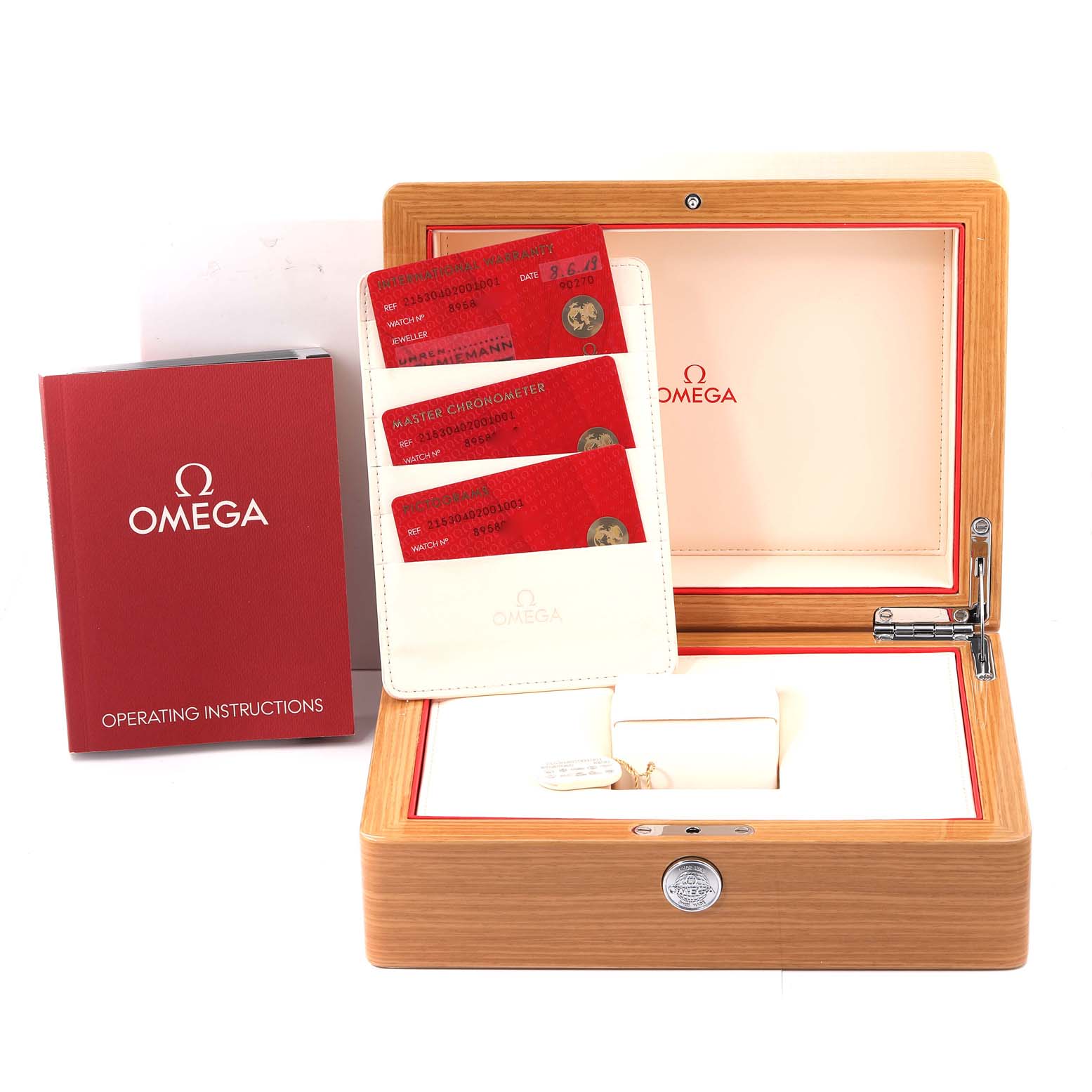 The image shows the packaging, operating instructions, and warranty cards for the Omega Planet Ocean 215.30.40.20.01.001 Men
s Stainless Steel Black Dial 215.30.40.20.01.001 Men
s Stainless Steel Black Dial watch.