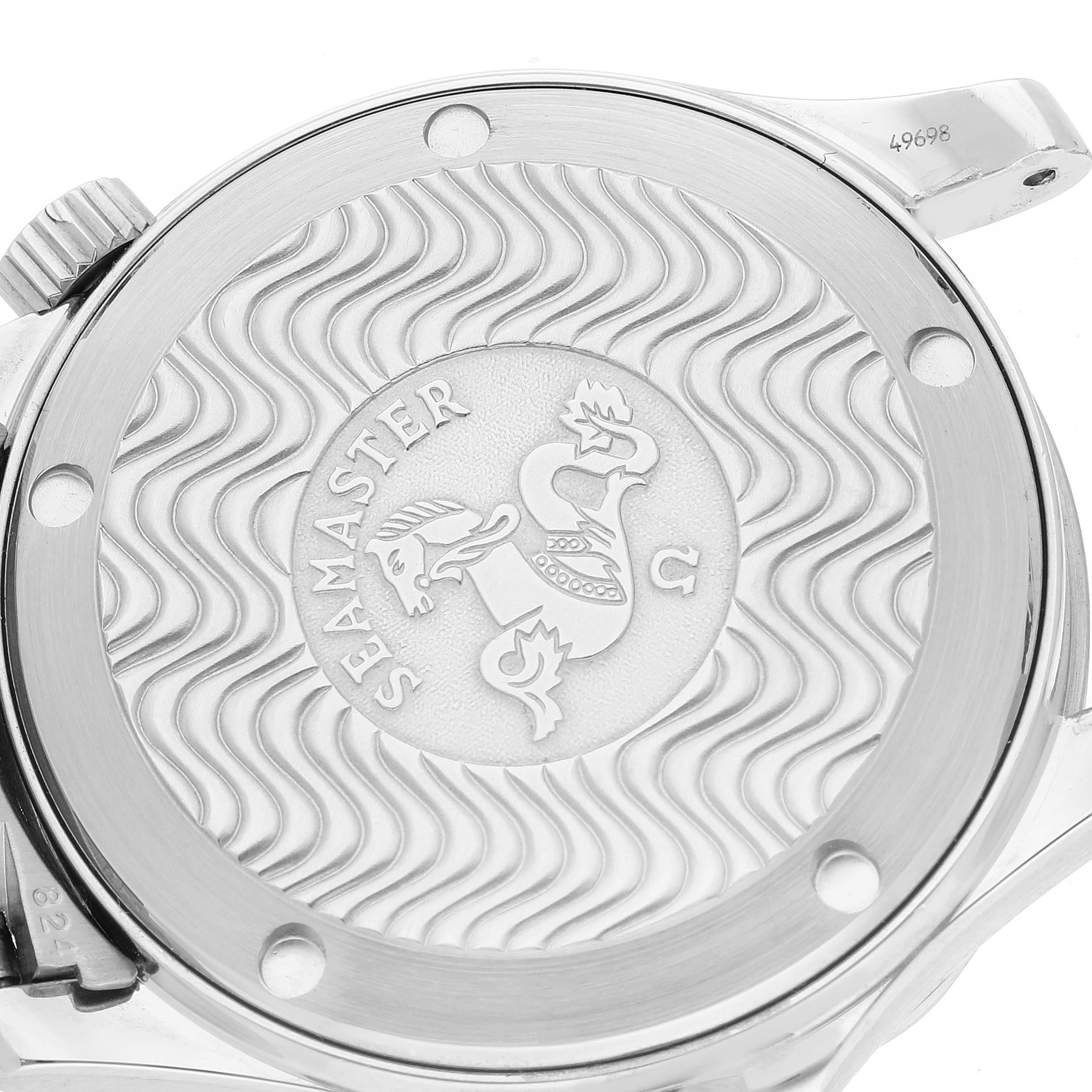 The image shows the case back of an Omega Seamaster 2551.80.00 Men's Stainless Steel Blue Dial 2551.80.00 Men's Stainless Steel Blue Dial watch, highlighting its engraved logo and wavy design.