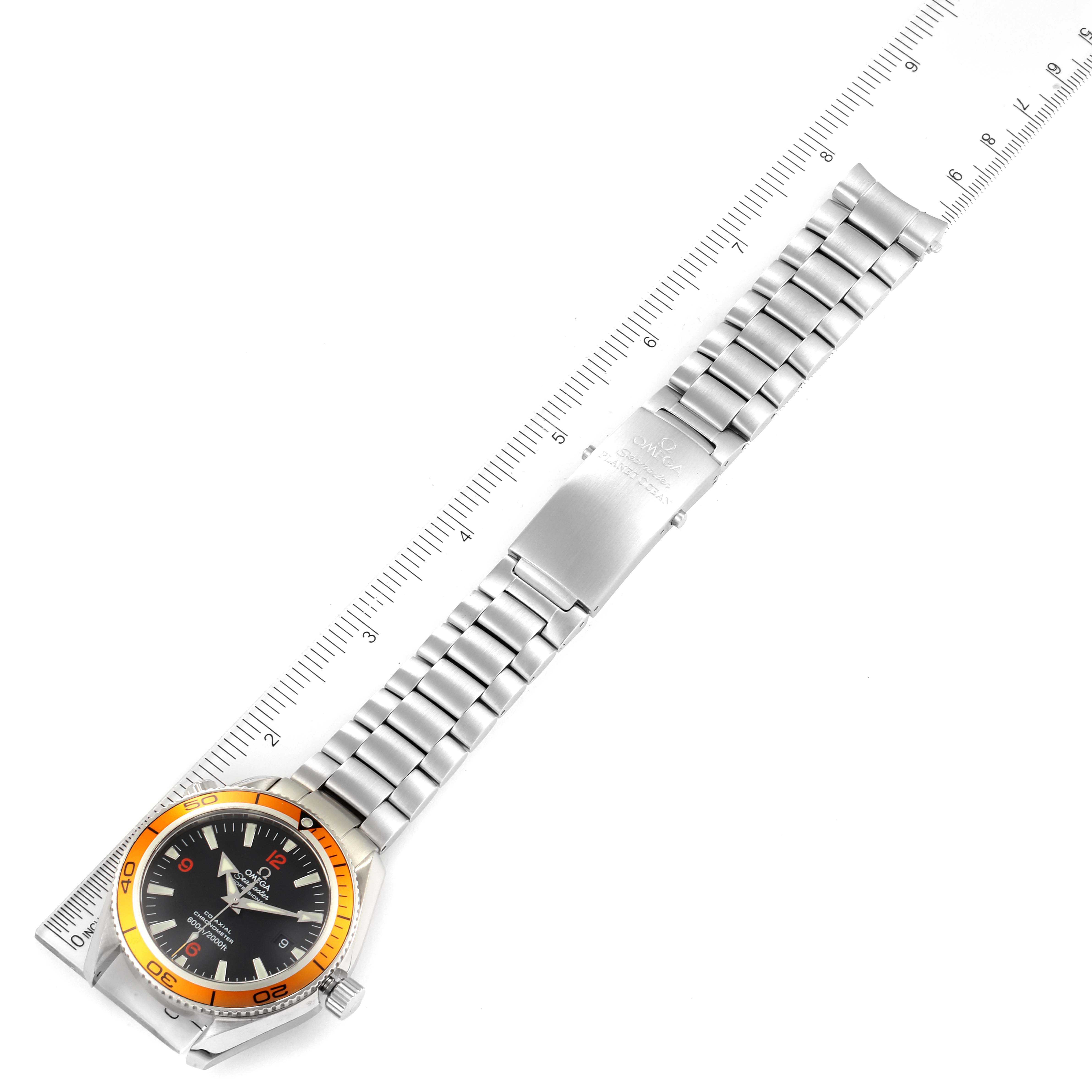 The Omega Planet Ocean 2208.50.00 Men
s Stainless Steel Black Dial 2208.50.00 Men
s Stainless Steel Black Dial watch is shown flat, displaying its face, bezel, bracelet, and clasp with a ruler for scale.