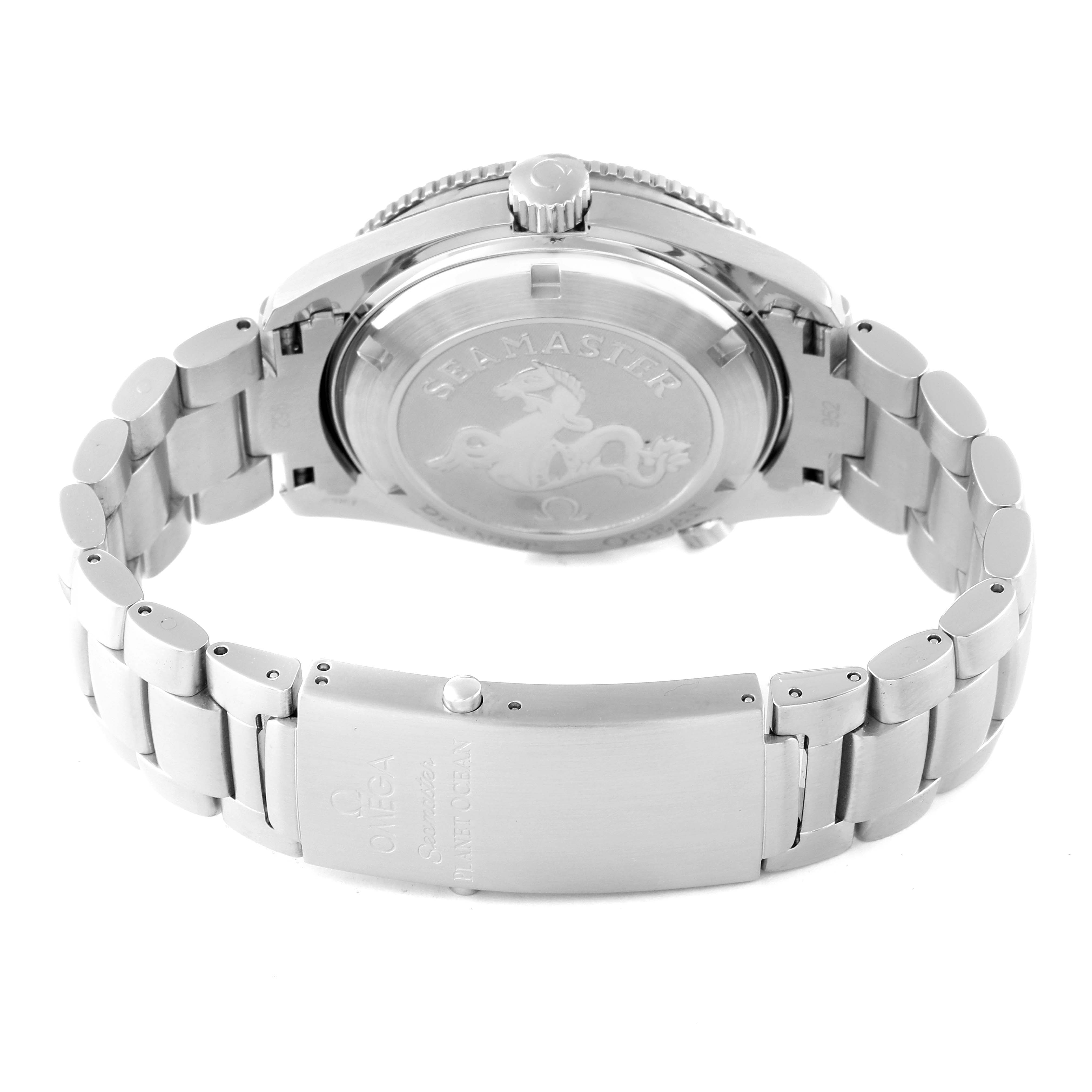 The image shows the back view of an Omega Planet Ocean 2208.50.00 Men
s Stainless Steel Black Dial 2208.50.00 Men
s Stainless Steel Black Dial watch, highlighting the metal bracelet and the engraved case back.