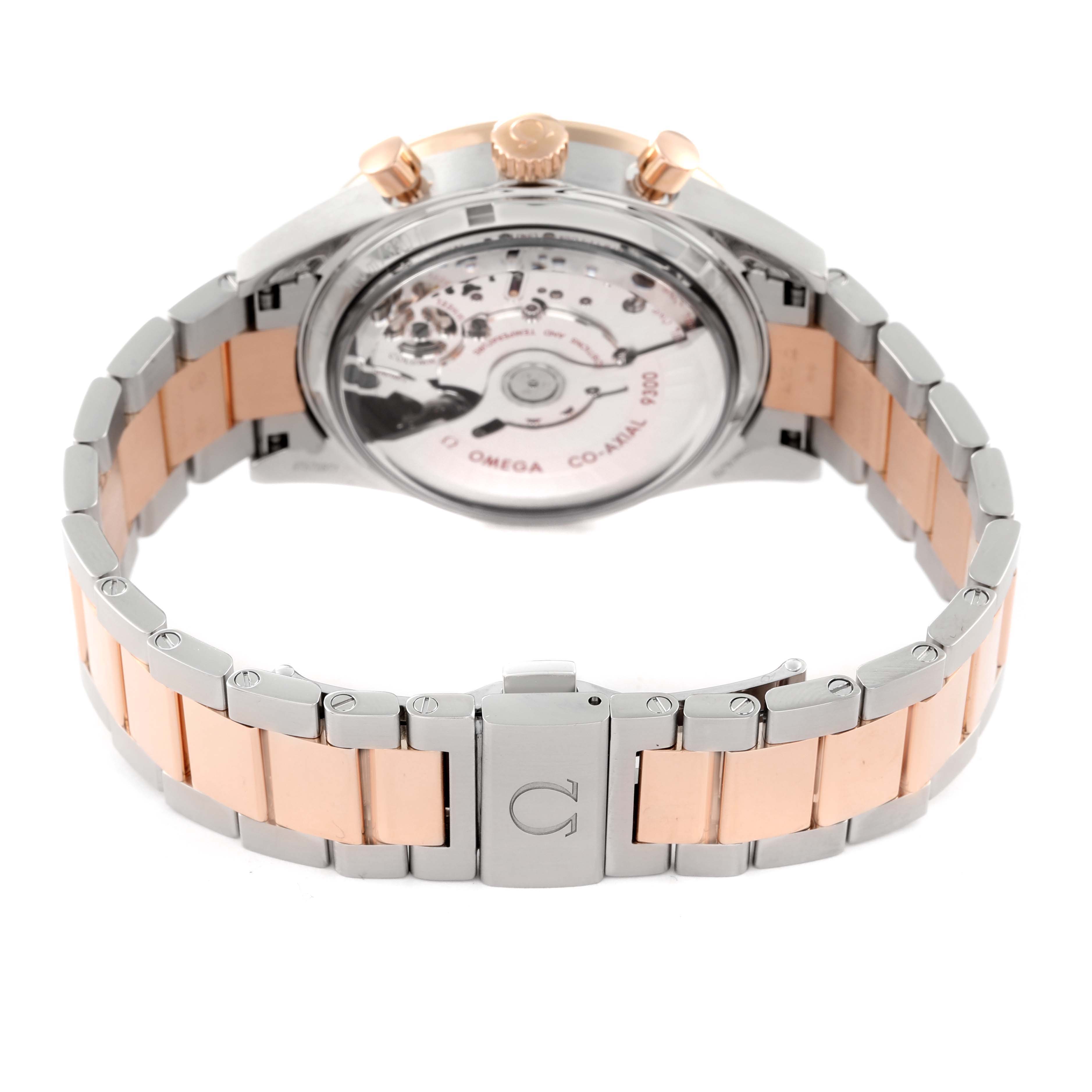 The image shows the back view and bracelet of an Omega Speedmaster 331.20.42.51.01.002 Men's Steel and Gold (two tone) Black Dial 331.20.42.51.01.002 Men's Steel and Gold (two tone) Black Dial, focusing on its transparent case back and bi-tone metal bracelet.