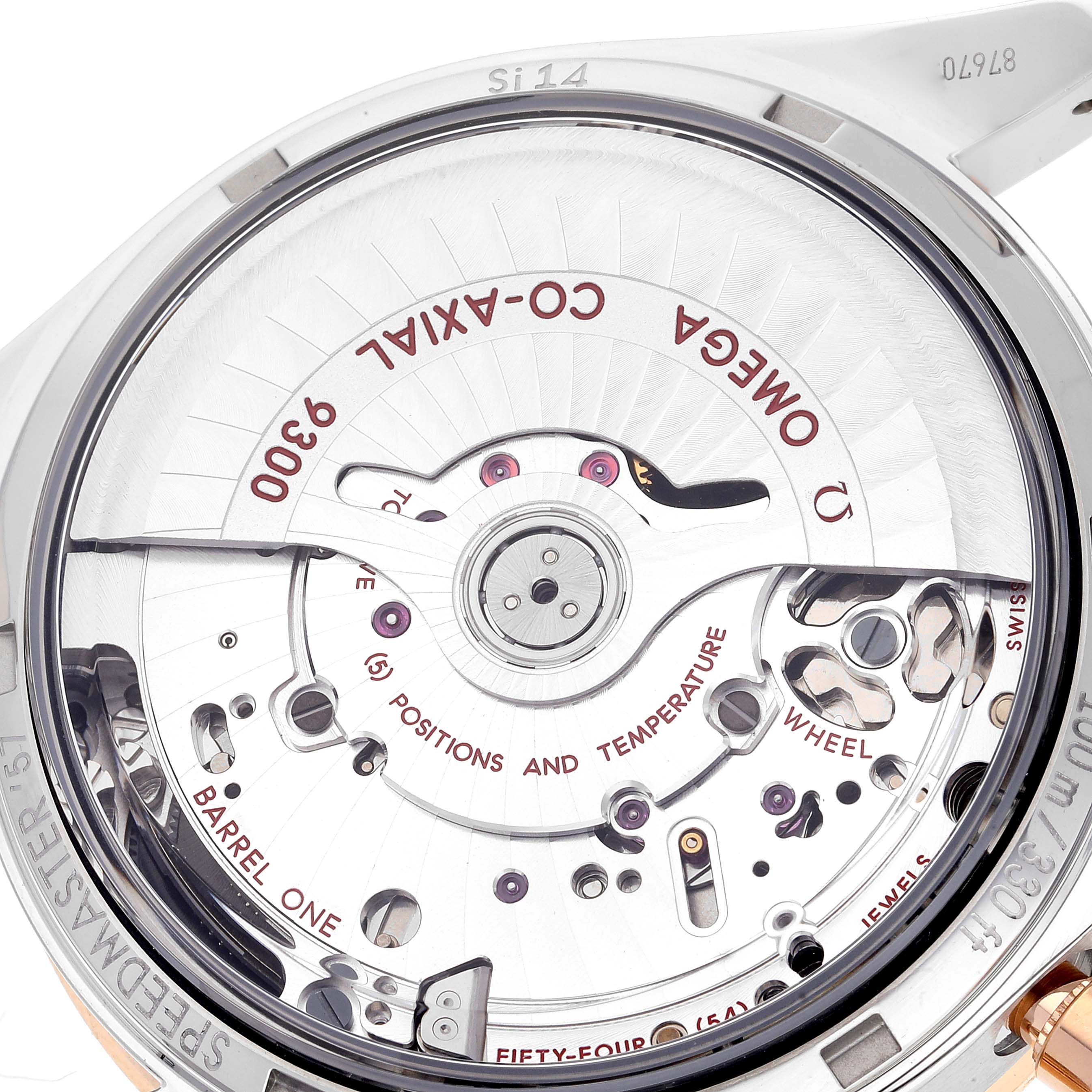 The image shows the back view of the Omega Speedmaster 331.20.42.51.01.002 Men's Steel and Gold (two tone) Black Dial 331.20.42.51.01.002 Men's Steel and Gold (two tone) Black Dial, focusing on the Co-Axial 9300 movement mechanism.