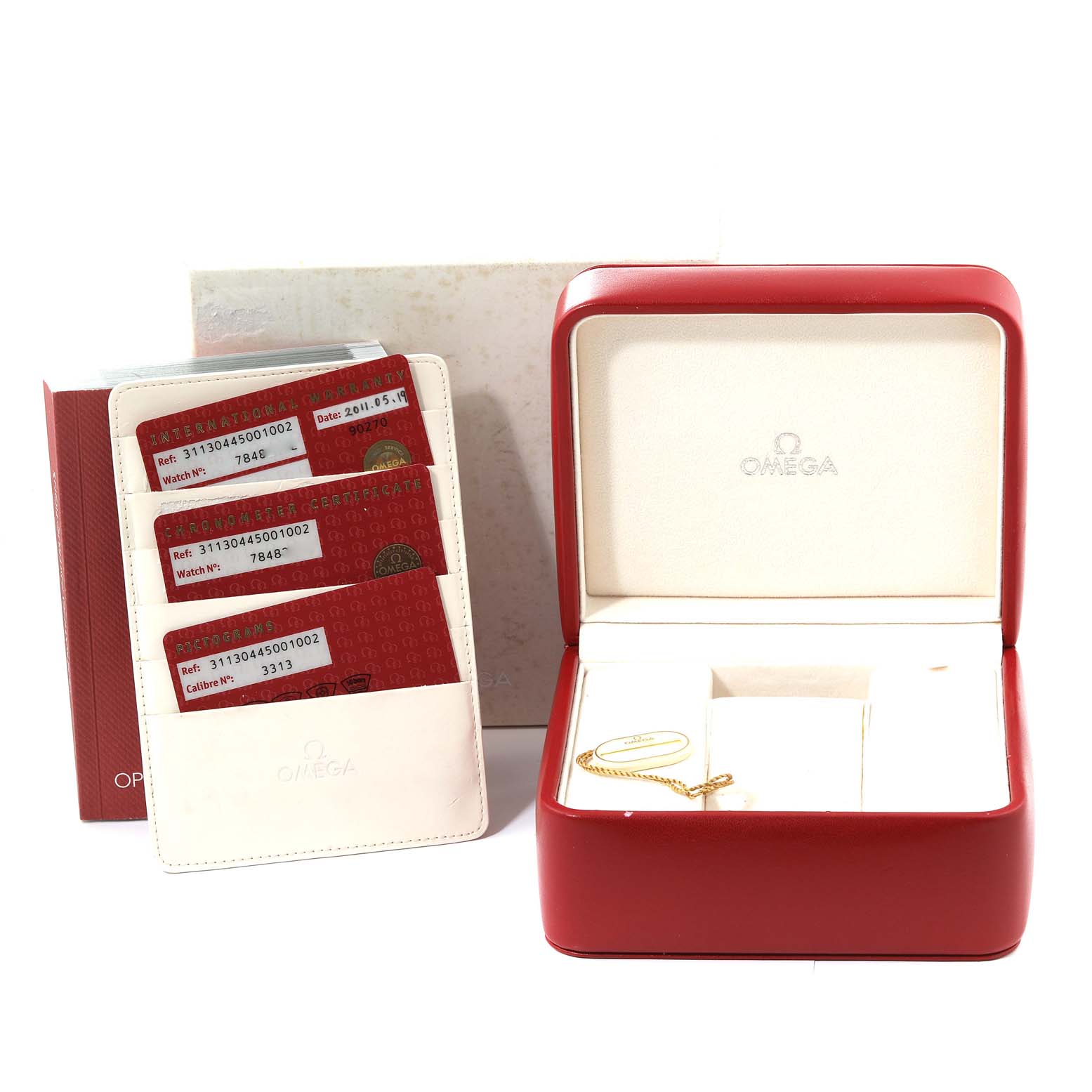 The image shows the open case and certification cards for an Omega Speedmaster 311.30.44.50.01.002 Men
s Stainless Steel Black Dial 311.30.44.50.01.002 Men
s Stainless Steel Black Dial watch.