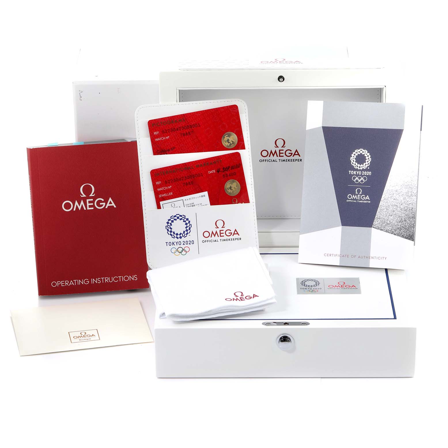 The image shows the Omega Speedmaster 522.30.42.30.03.001 Men's Stainless Steel Blue Dial 522.30.42.30.03.001 Men's Stainless Steel Blue Dial model's packaging, including the operating instructions, certificate, authenticity cards, and a cleaning cloth.