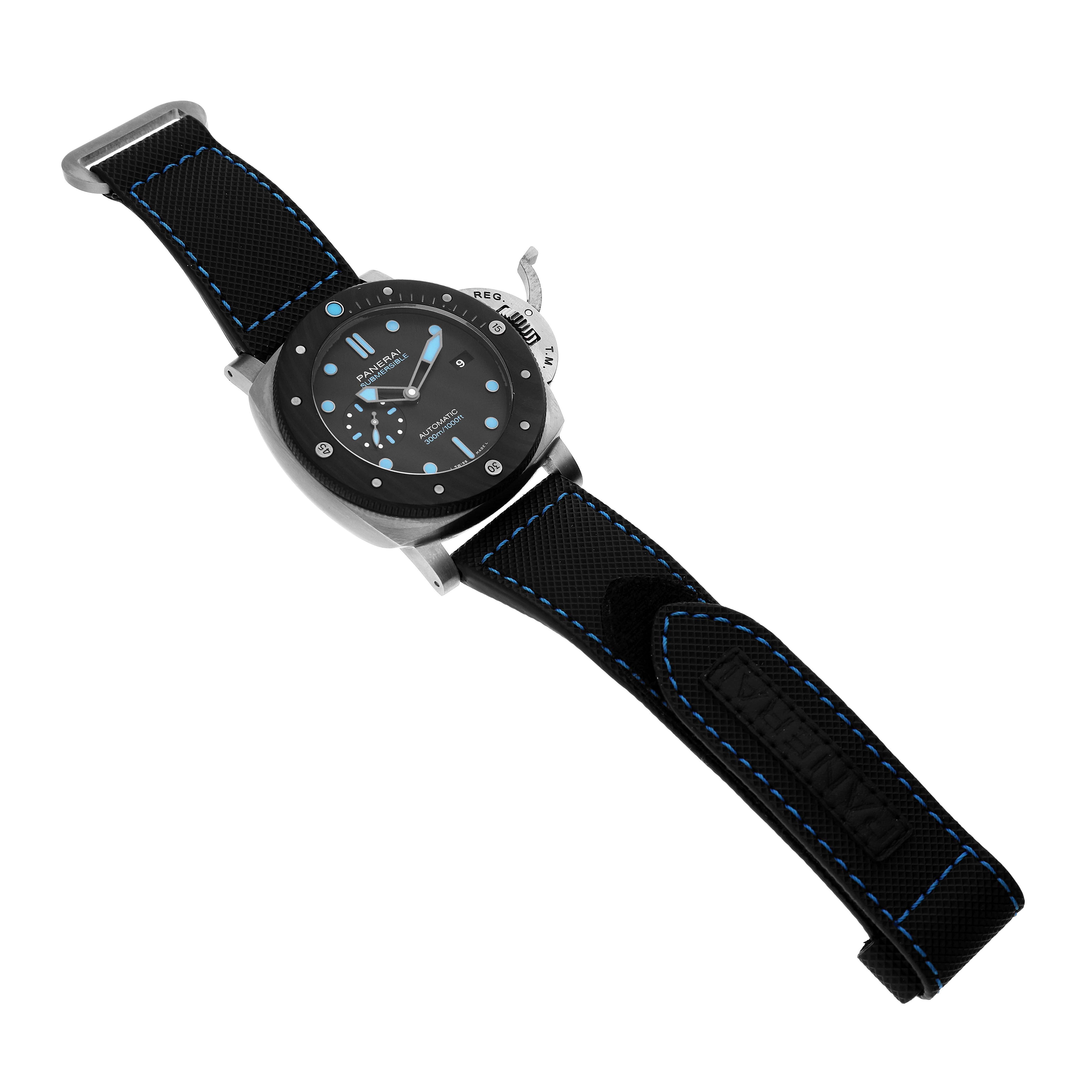 The Panerai Submersible PAM00799 Men's Titanium Black Dial watch is shown at an angled view displaying the face, case, and straps with blue stitching.