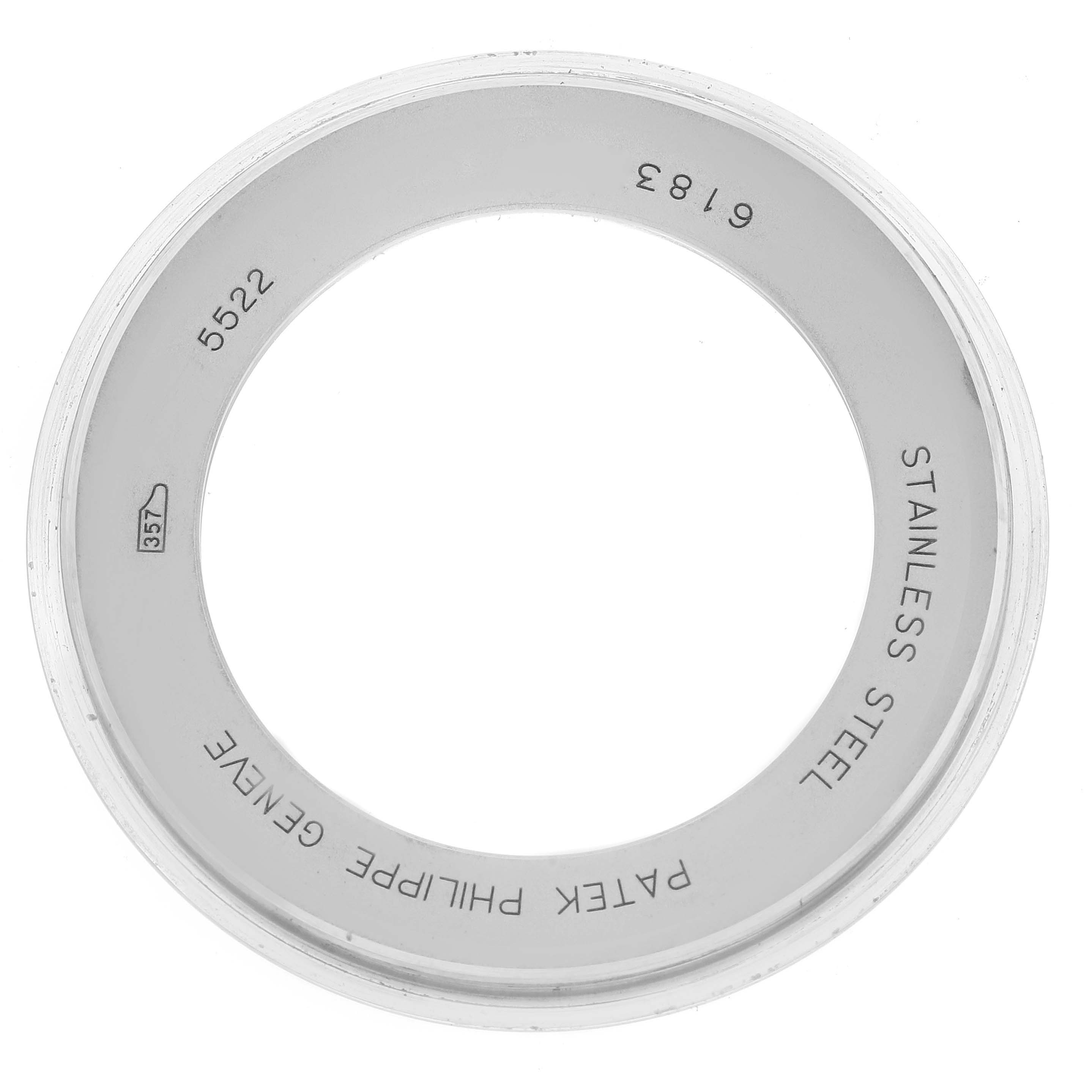 This image shows a top-down view of a stainless steel bezel for the Patek Philippe Calatrava 5522A-001 Men's Stainless Steel Blue Dial 5522A-001 Men's Stainless Steel Blue Dial model, featuring inscriptions inside.