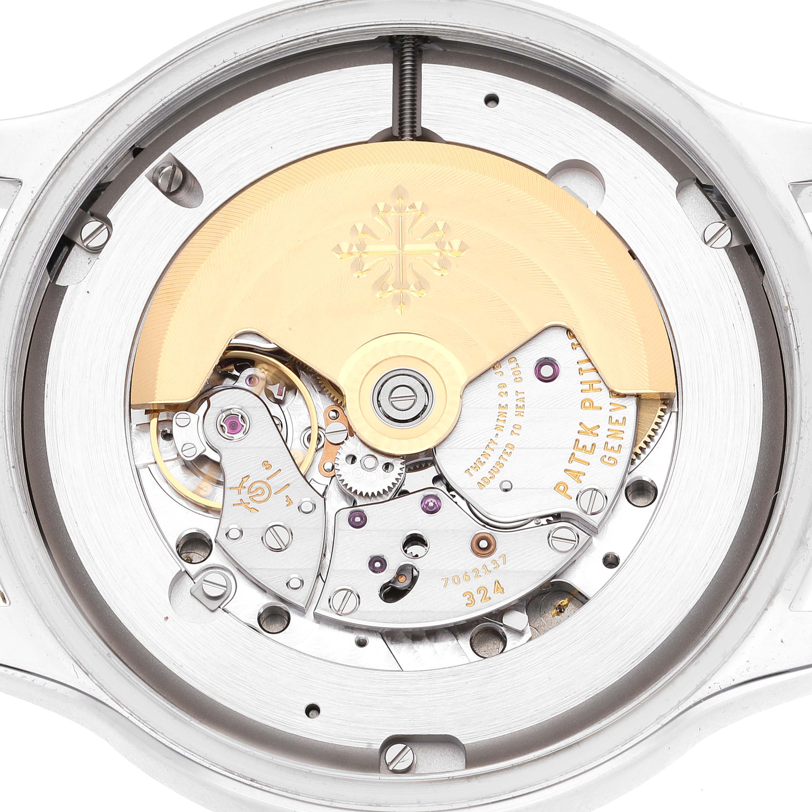 The image shows the intricate inner movement mechanism of a Patek Philippe Calatrava 5522A-001 Men's Stainless Steel Blue Dial 5522A-001 Men's Stainless Steel Blue Dial watch from a back angle.