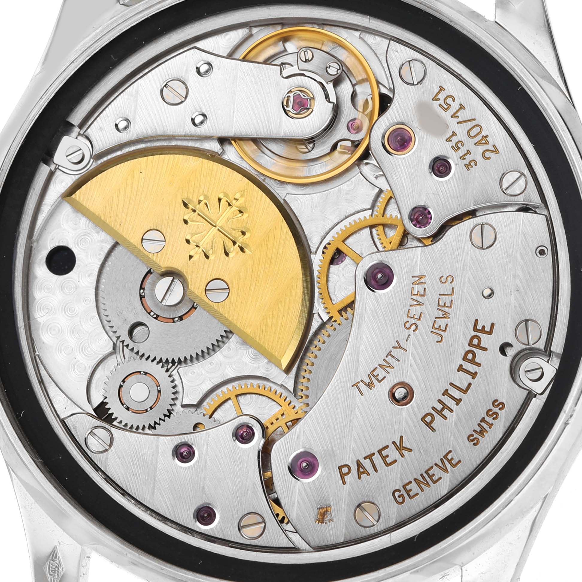 This image shows the movement of a Patek Philippe Calatrava 5026P-001 Men's Platinum Black Dial watch from the back, highlighting gears and the rotor.