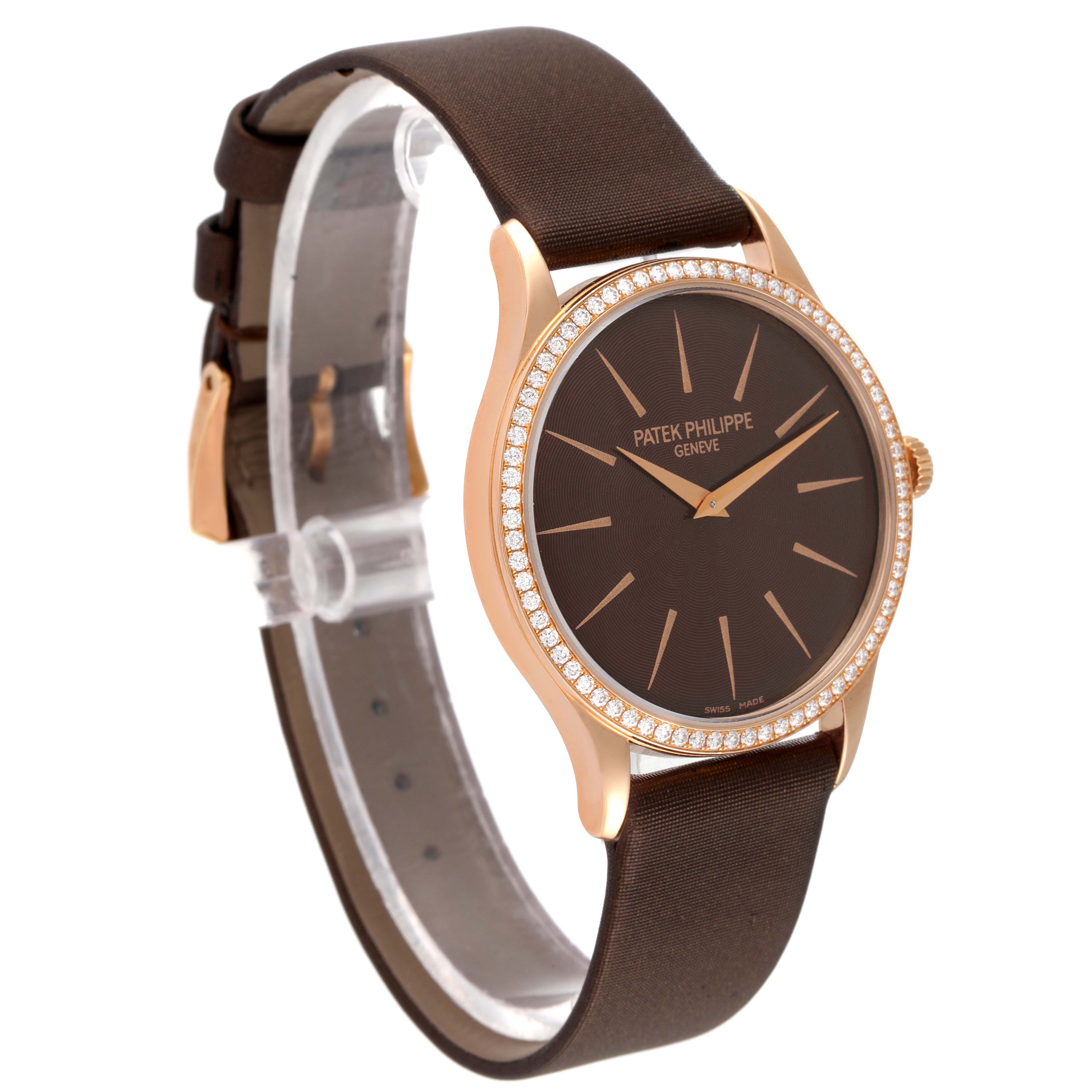 This image shows a Patek Philippe Calatrava 4897R-001 Women
s Rose Gold Brown Dial 4897R-001 Women
s Rose Gold Brown Dial watch at a three-quarter angle, highlighting its dial, bezel, and part of the strap.