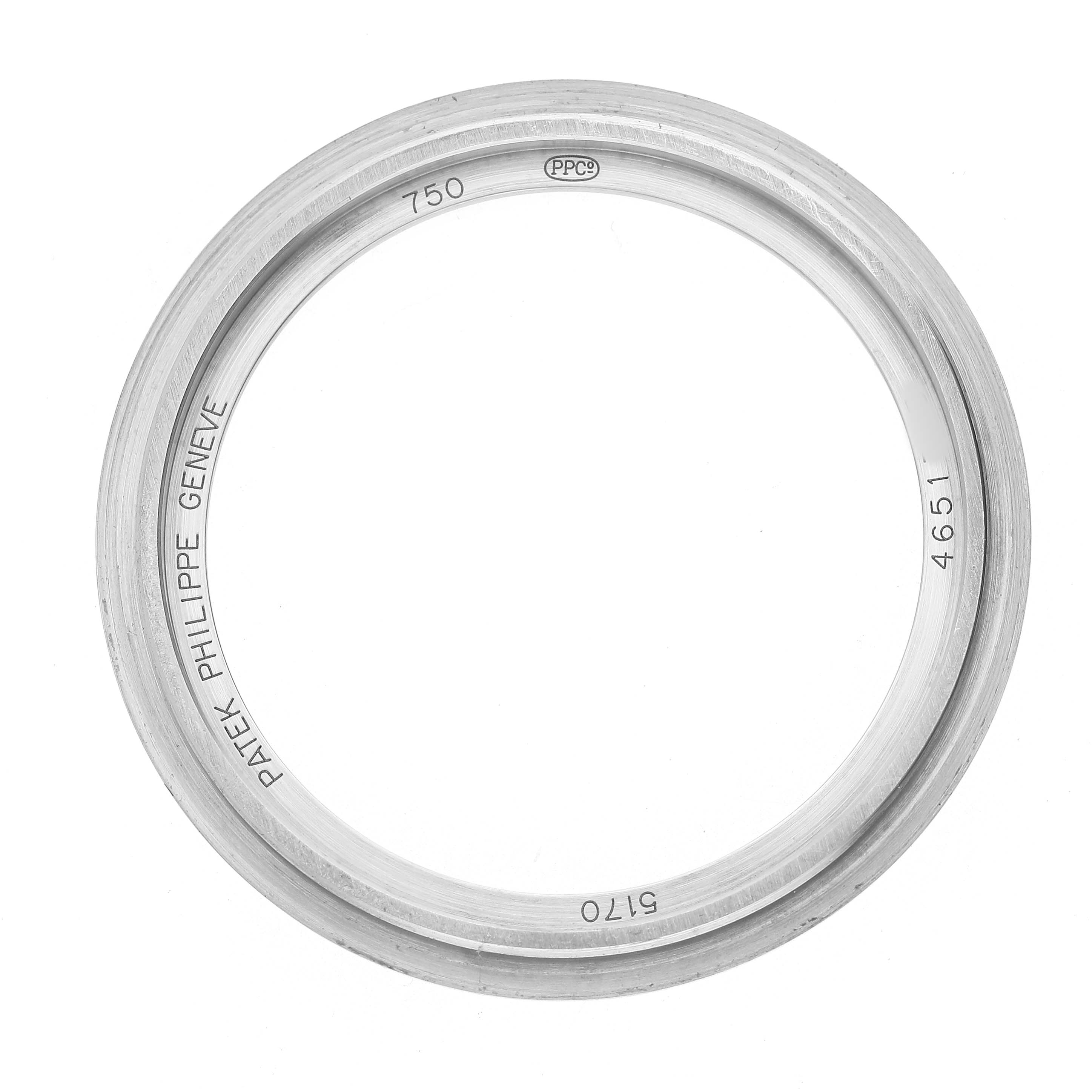 The image shows a metal bezel from a Patek Philippe Complications 5170G-001 Men's White Gold White Dial model, viewed from above with engravings visible.