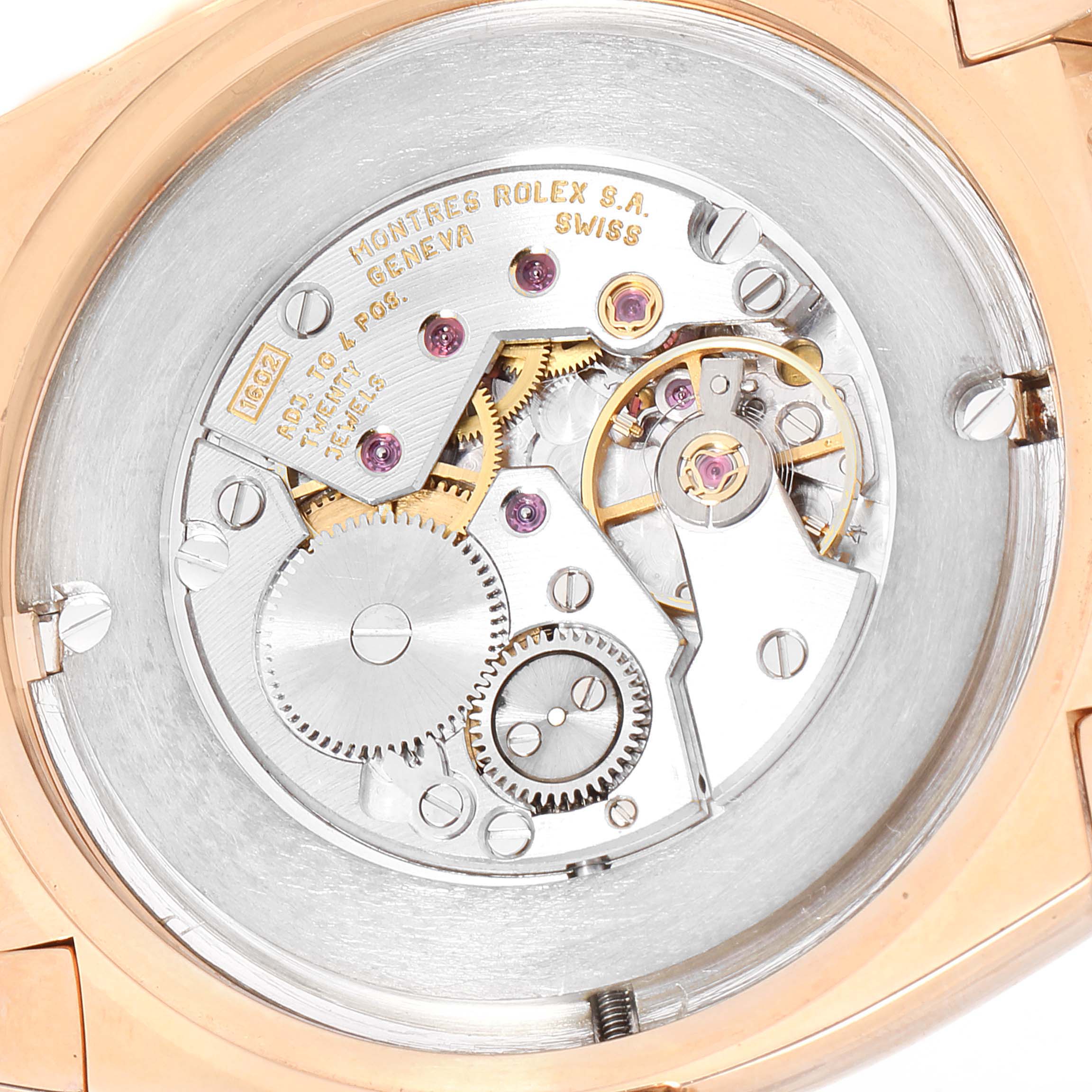 This image shows the back side of the Rolex Cellini 5330 Men's Rose Gold White Dial 5330 Men's Rose Gold White Dial watch, highlighting the intricate movement and gears inside the case.