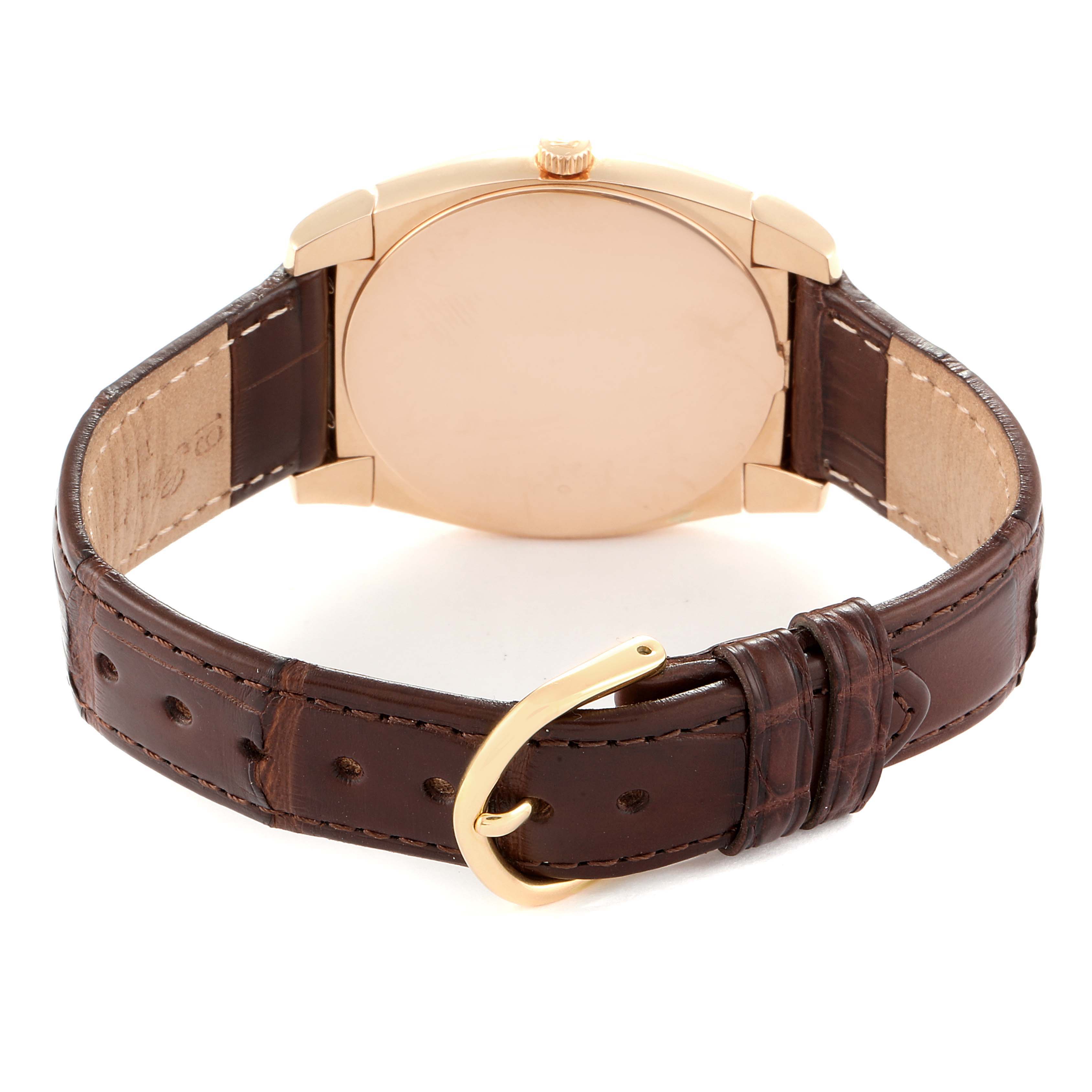 The image shows the back view of a Rolex Cellini 5330 Men's Rose Gold White Dial 5330 Men's Rose Gold White Dial watch with a gold case and brown leather strap.