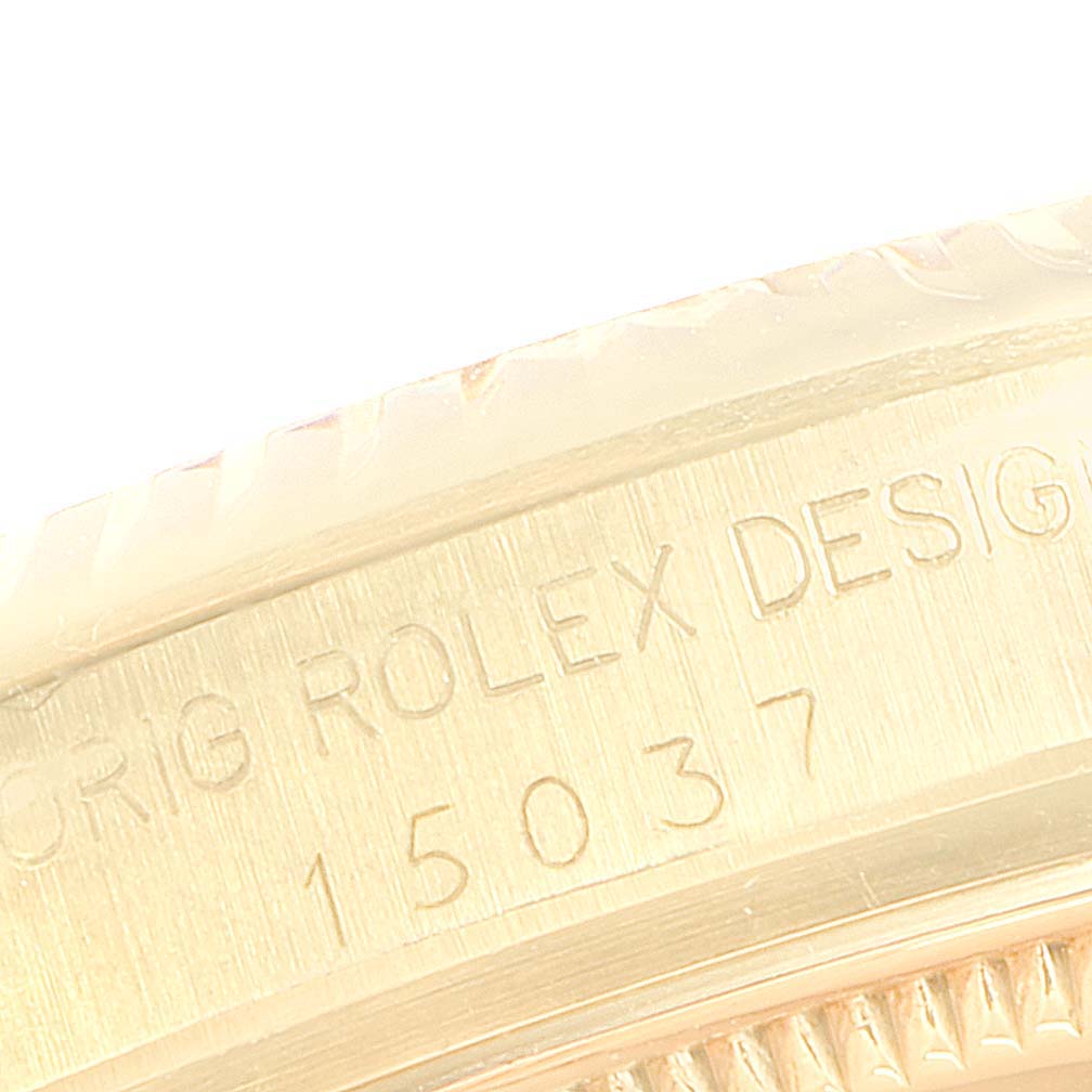 The image shows an extreme close-up of the edge featuring engraved text of the Vintage Collection model by Rolex.