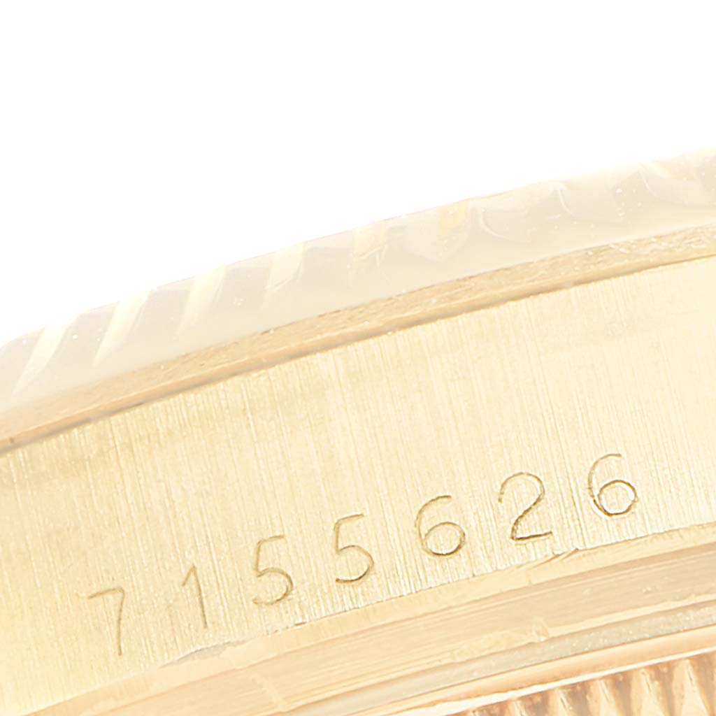 The image shows a close-up angle of the serial number engraved on the case side of a Rolex Vintage Collection 15037 Men
s Yellow Gold Blue Dial 15037 Men
s Yellow Gold Blue Dial model.