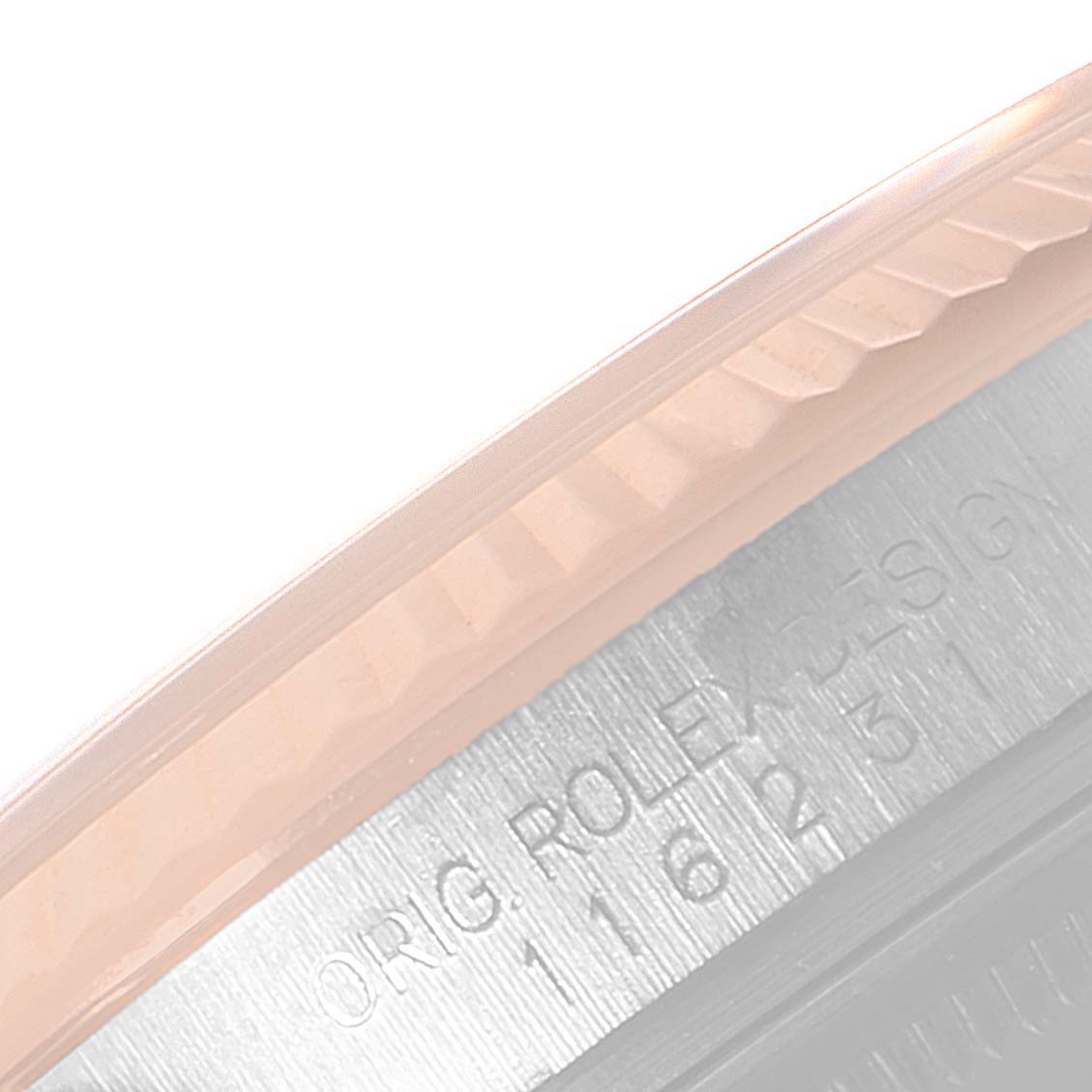 The image shows a close-up angled view of the fluted bezel and engraved case edge of a Rolex Datejust 116231 Men's Steel and Gold (two tone) Black Dial 116231 Men's Steel and Gold (two tone) Black Dial watch.