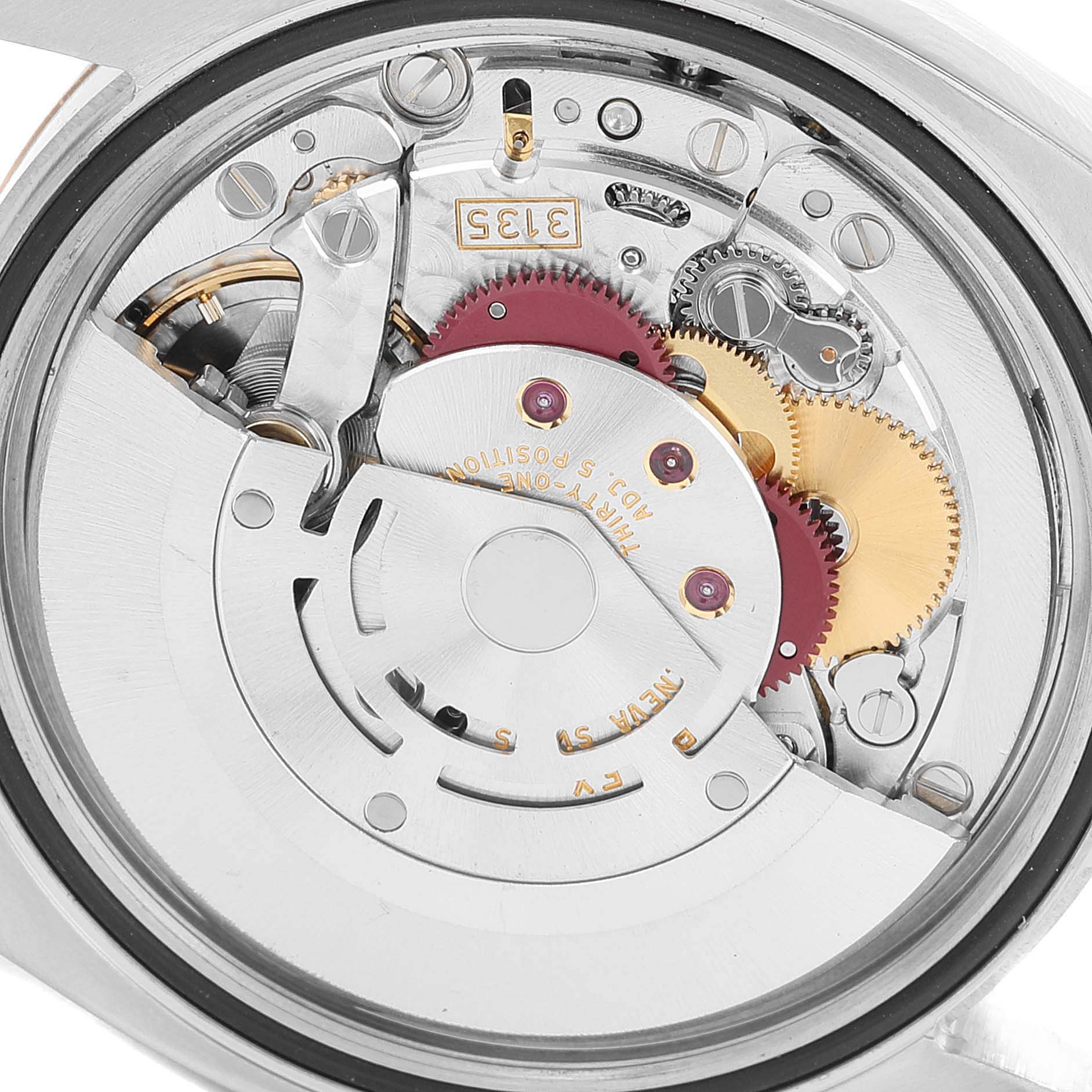 The image shows the intricate internal mechanism of the Rolex Datejust 116231 Men's Steel and Gold (two tone) Black Dial 116231 Men's Steel and Gold (two tone) Black Dial watch from a close-up, top-down angle.