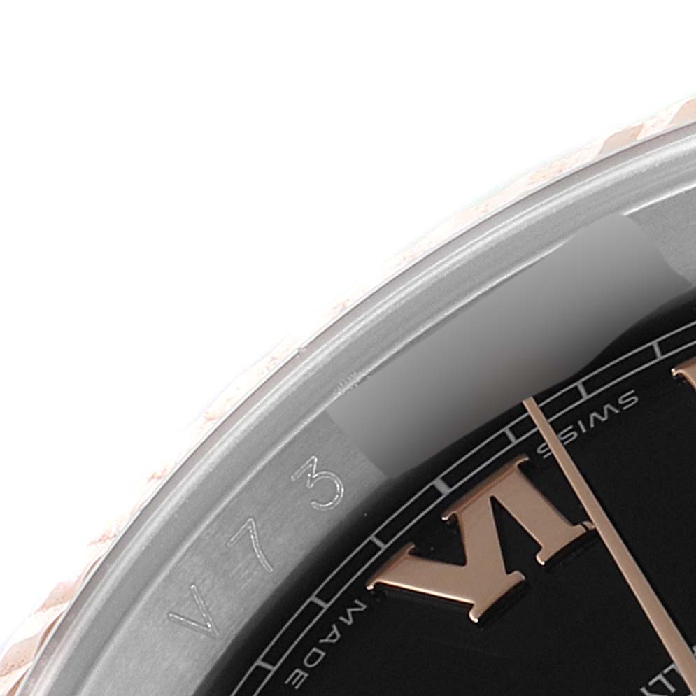 The image shows a close-up of the dial and bezel edge of a Rolex Datejust 116231 Men's Steel and Gold (two tone) Black Dial 116231 Men's Steel and Gold (two tone) Black Dial watch, highlighting the Roman numerals and part of the bezel.