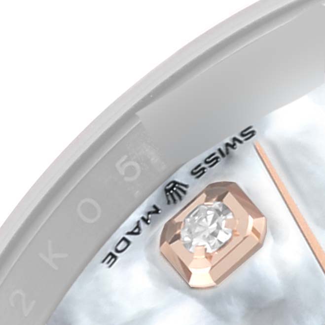 This close-up image shows a part of the Rolex Datejust 126281 Men's Steel and Gold (two tone) Mother of Pearl Dial 126281 Men's Steel and Gold (two tone) Mother of Pearl Dial watch face, including a diamond hour marker and the "Swiss Made" text.