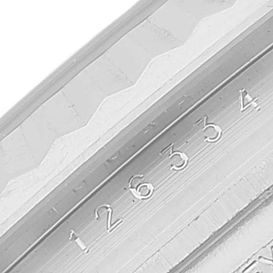 This image shows a close-up of the engraved serial number on the bezel of a Rolex Datejust 41 126334 Men
s Stainless Steel Blue Dial 126334 Men
s Stainless Steel Blue Dial watch.