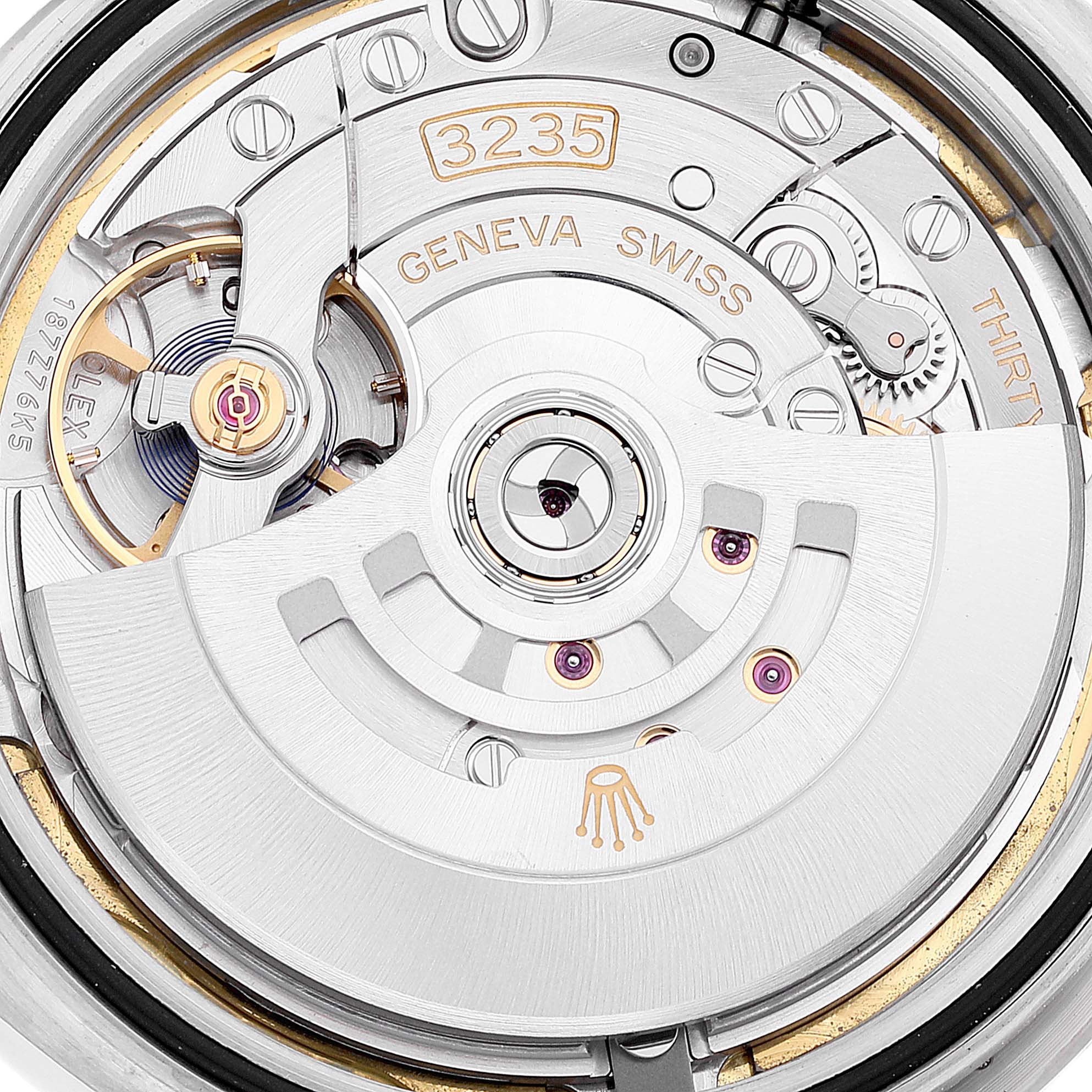 The image shows the inner mechanism of a Rolex Datejust 41 126334 Men's Stainless Steel White Dial 126334 Men's Stainless Steel White Dial model, specifically the automatic movement and rotor from the back view.