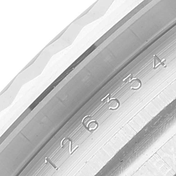 The image shows a close-up of the fluted bezel and part of the rehaut of the Rolex Datejust 41 126334 Men's Stainless Steel White Dial 126334 Men's Stainless Steel White Dial model.