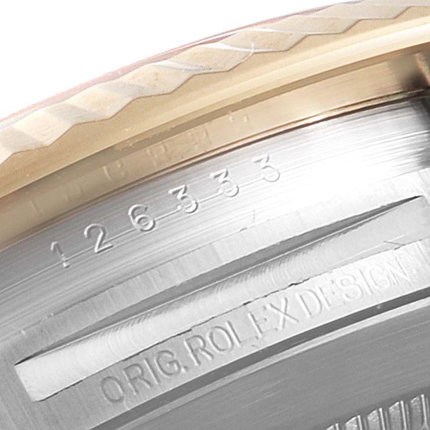 This close-up image shows the inner engraving and edge detail of the bezel of a Rolex Datejust 41 126333 Men's Stainless Steel White Dial 126333 Men's Stainless Steel White Dial watch.