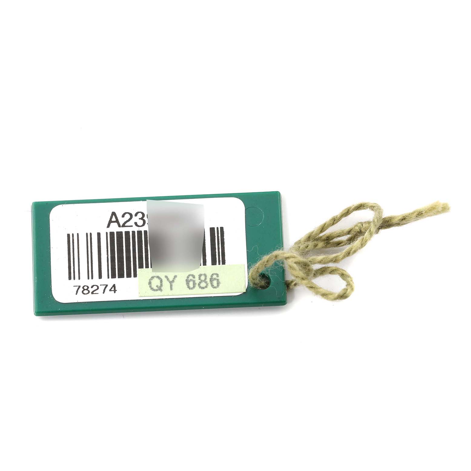 This image shows a green tag with a barcode and string, likely an accessory for the Rolex Mid-Size 78274 Women
s Stainless Steel Silver Dial 78274 Women
s Stainless Steel Silver Dial model watch.