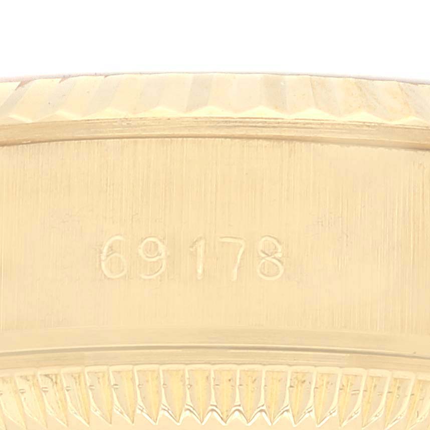 This image shows a close-up of the side engraving on a Rolex President 69178 Women
s Yellow Gold Champagne Dial 69178 Women
s Yellow Gold Champagne Dial model watch, displaying the reference number "69178".