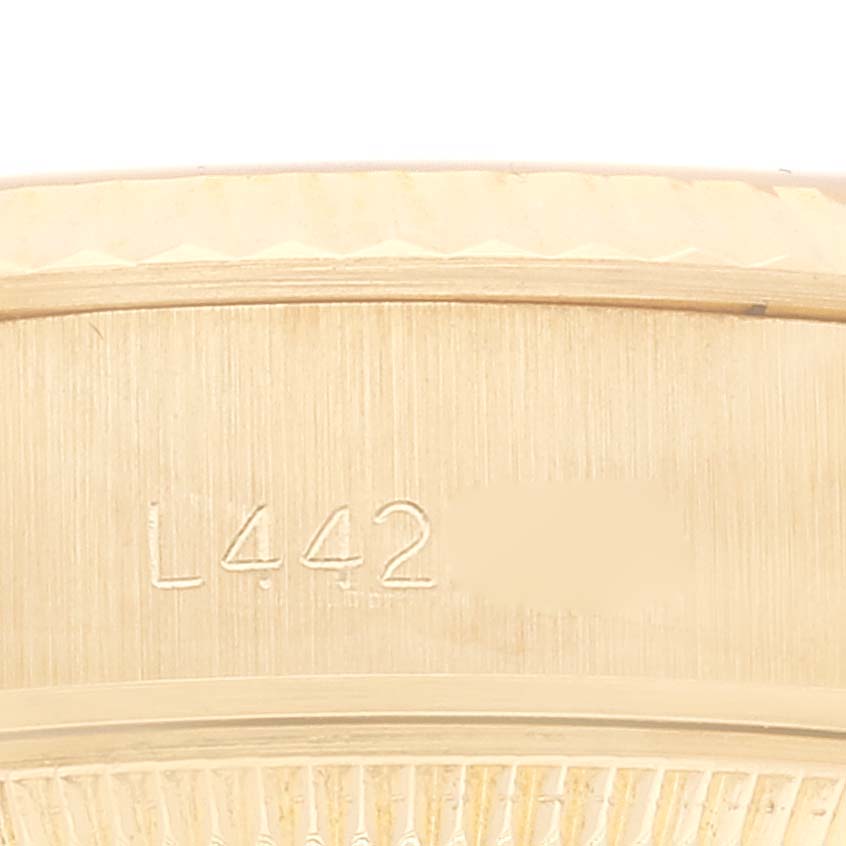 The image shows a close-up view of the serial number engraved on the Rolex President 69178 Women
s Yellow Gold Champagne Dial 69178 Women
s Yellow Gold Champagne Dial model watch.