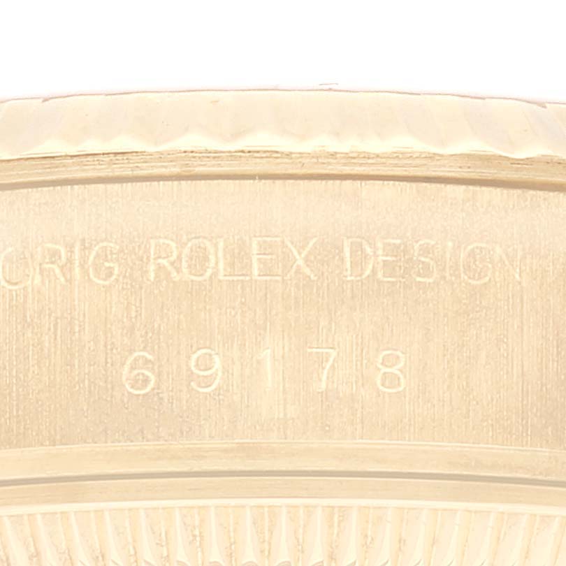 The image shows a close-up of the side of a Rolex President 69178 Women's Yellow Gold White Dial 69178 Women's Yellow Gold White Dial model watch, highlighting the engraved model number "69178."
