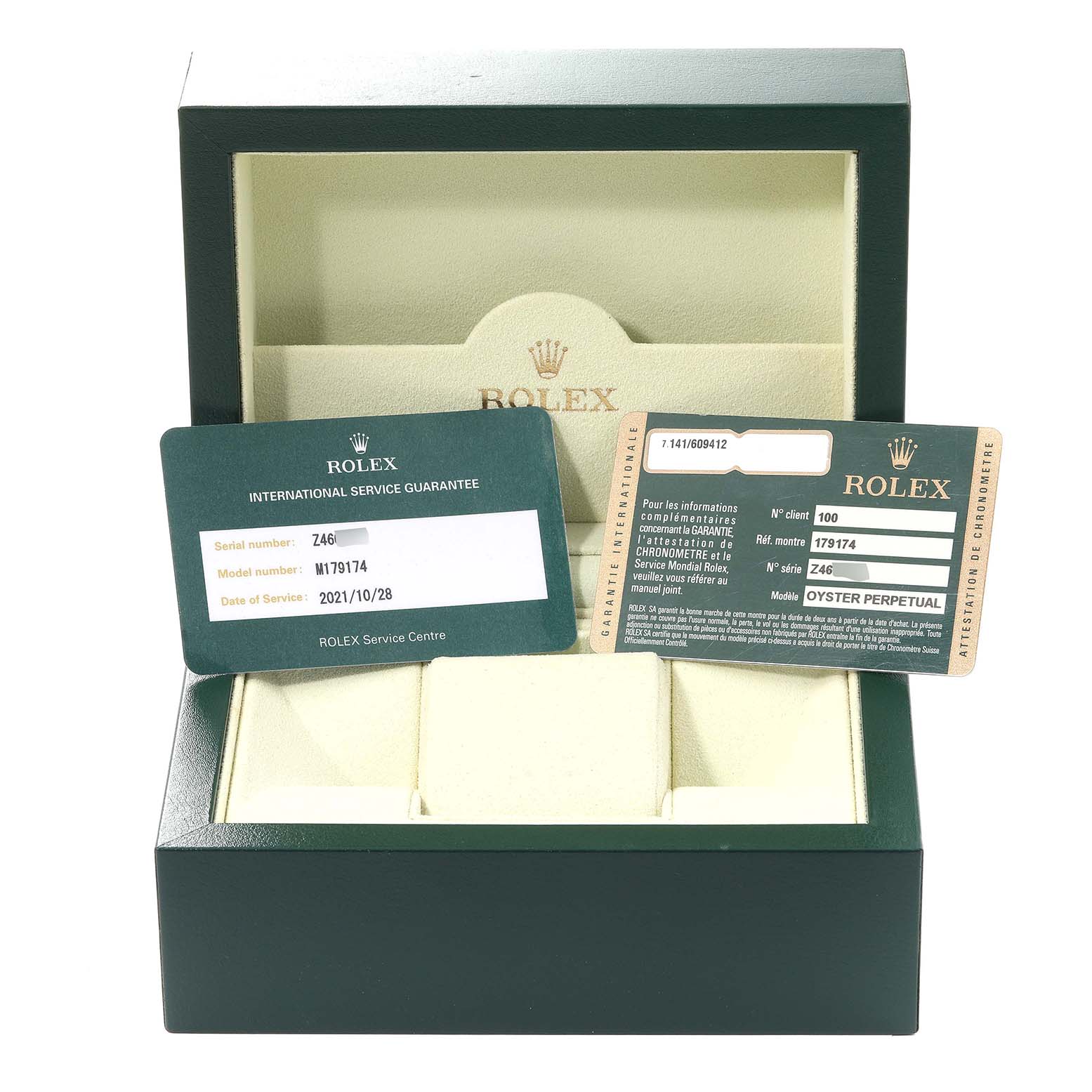 The image shows an open Rolex Datejust M179174 Women's Stainless Steel White Dial M179174 Women's Stainless Steel White Dial box with international service guarantee cards inside.