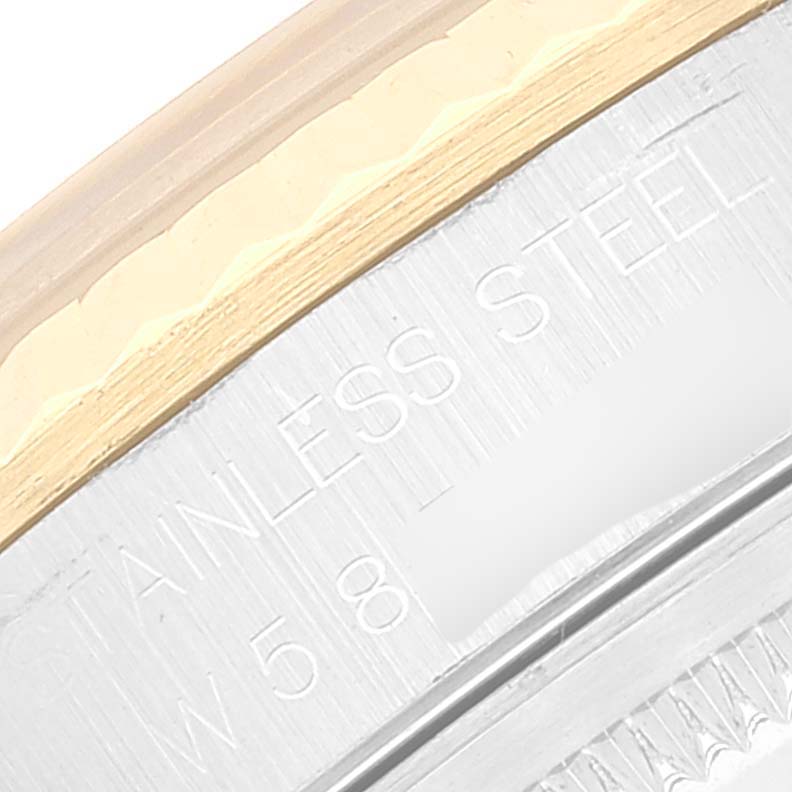 The image shows a close-up of the engraving on the stainless steel back of a Rolex Datejust 16233 Men's Steel and Gold (two tone) Silver Dial 16233 Men's Steel and Gold (two tone) Silver Dial watch.