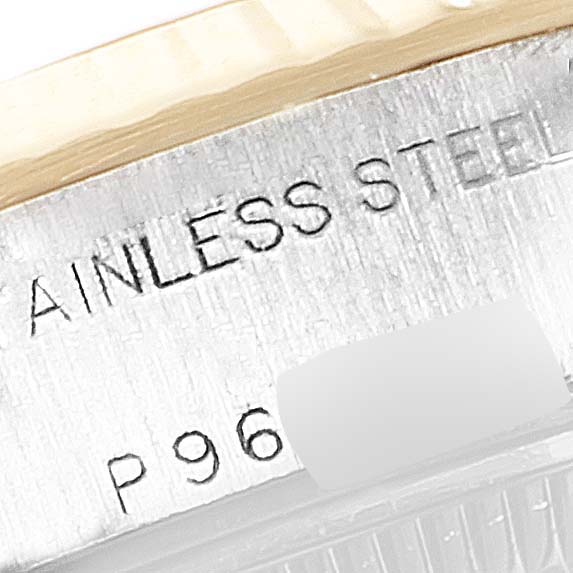 This close-up image shows the stainless steel and part of the fluted bezel of a Rolex Datejust 69173 Women's Steel and Gold (two tone) White Dial 69173 Women's Steel and Gold (two tone) White Dial watch.