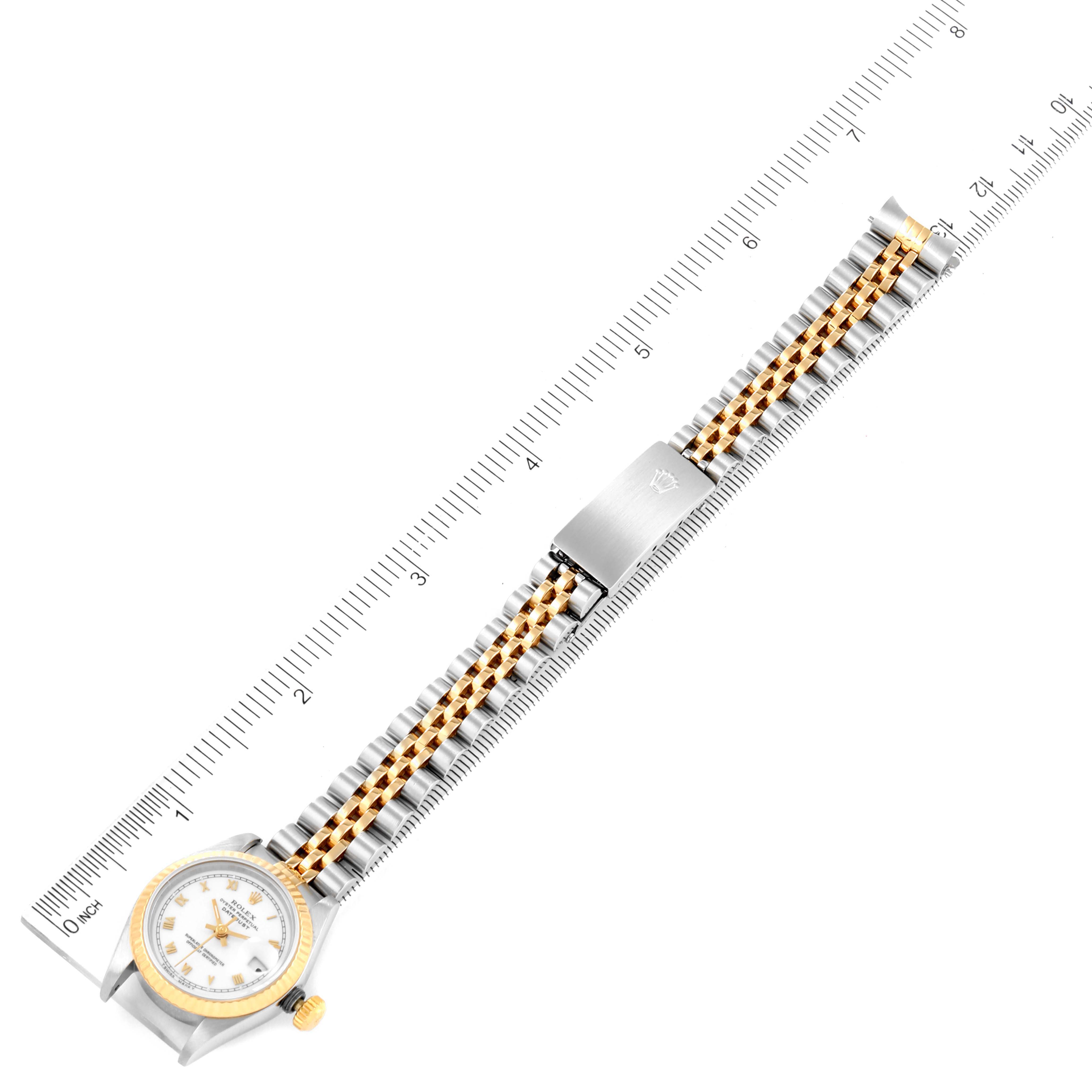 The image shows a top view of a Rolex Datejust 69173 Women's Steel and Gold (two tone) White Dial 69173 Women's Steel and Gold (two tone) White Dial watch, including the dial, bezel, crown, bracelet, and the clasp.
