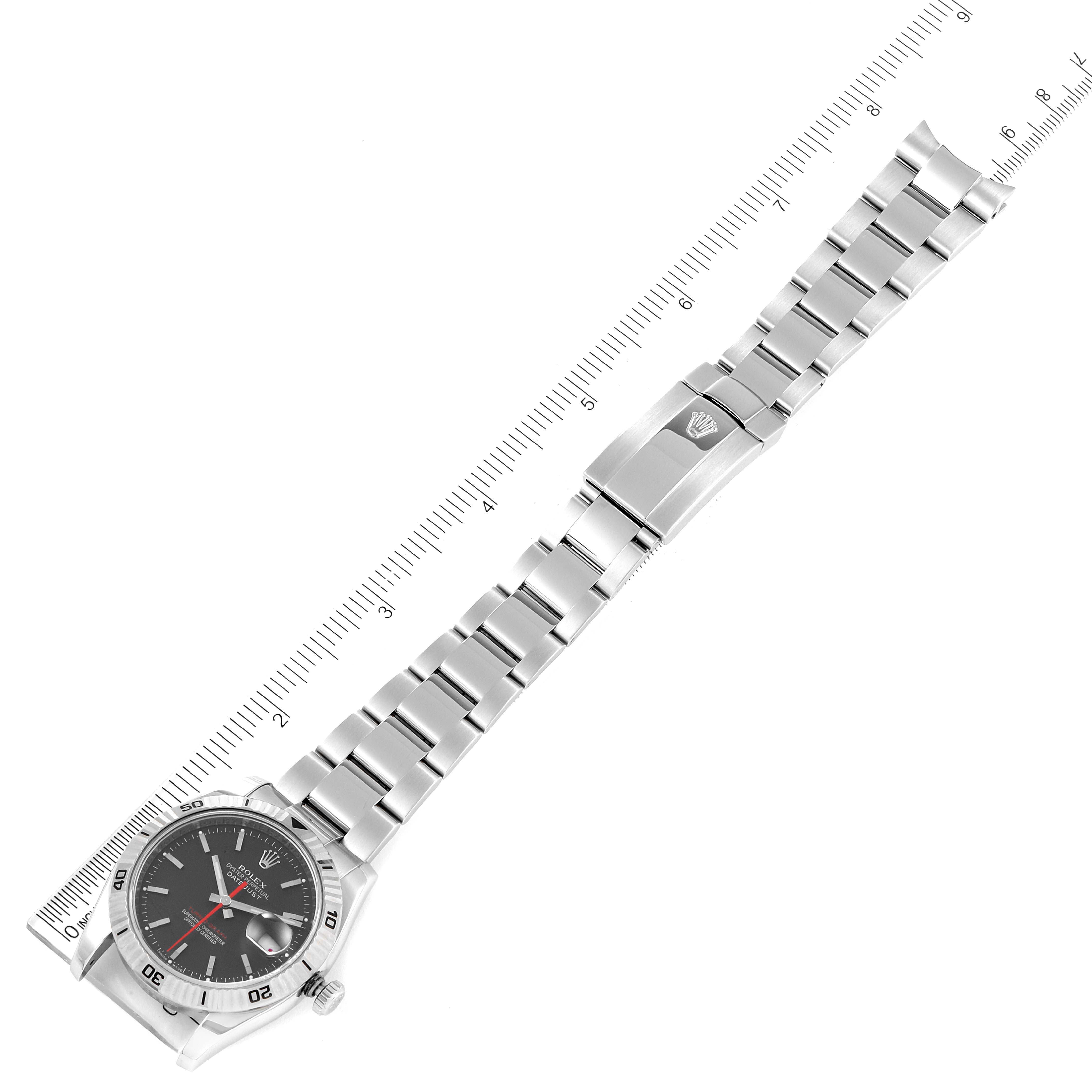 The Rolex Turn-o-Graph 116264 Men's Stainless Steel Black Dial 116264 Men's Stainless Steel Black Dial watch is shown fully extended with the dial and entire bracelet visible, alongside a ruler for measurement.