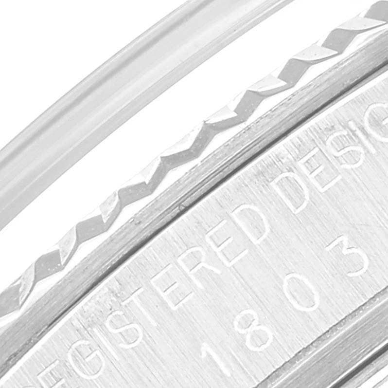 This close-up image shows the engraved case back edge of a Rolex Vintage Collection 1803 Men's White Gold Silver Dial 1803 Men's White Gold Silver Dial model watch.