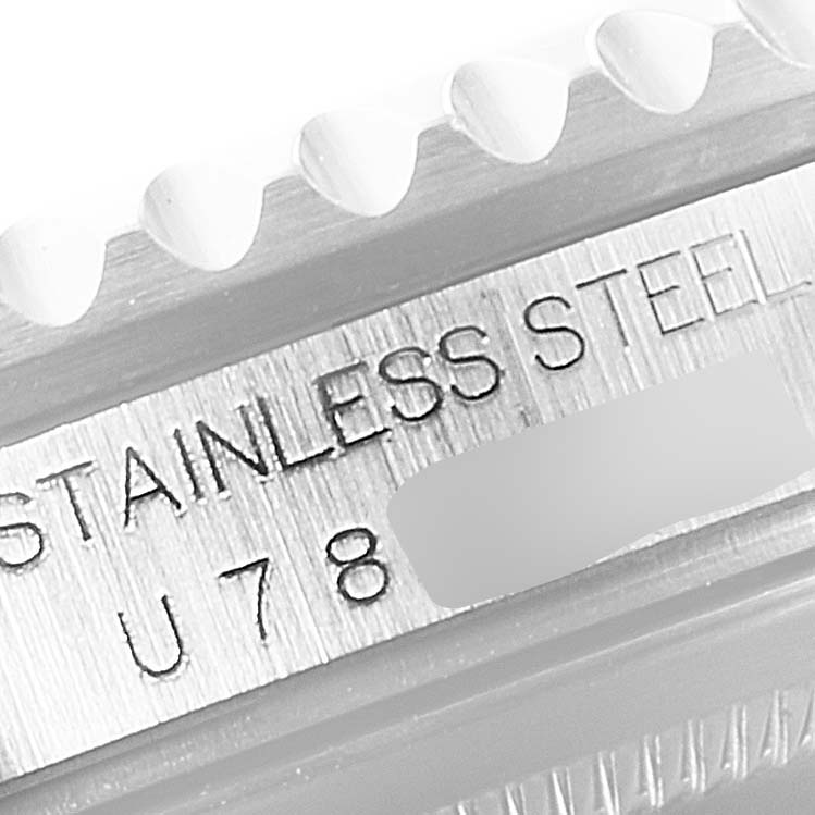 This image shows a close-up of the side engraving and bezel of the Rolex GMT-Master 16700 Men
s Stainless Steel Black Dial 16700 Men
s Stainless Steel Black Dial watch, highlighting the "STAINLESS STEEL" inscription.