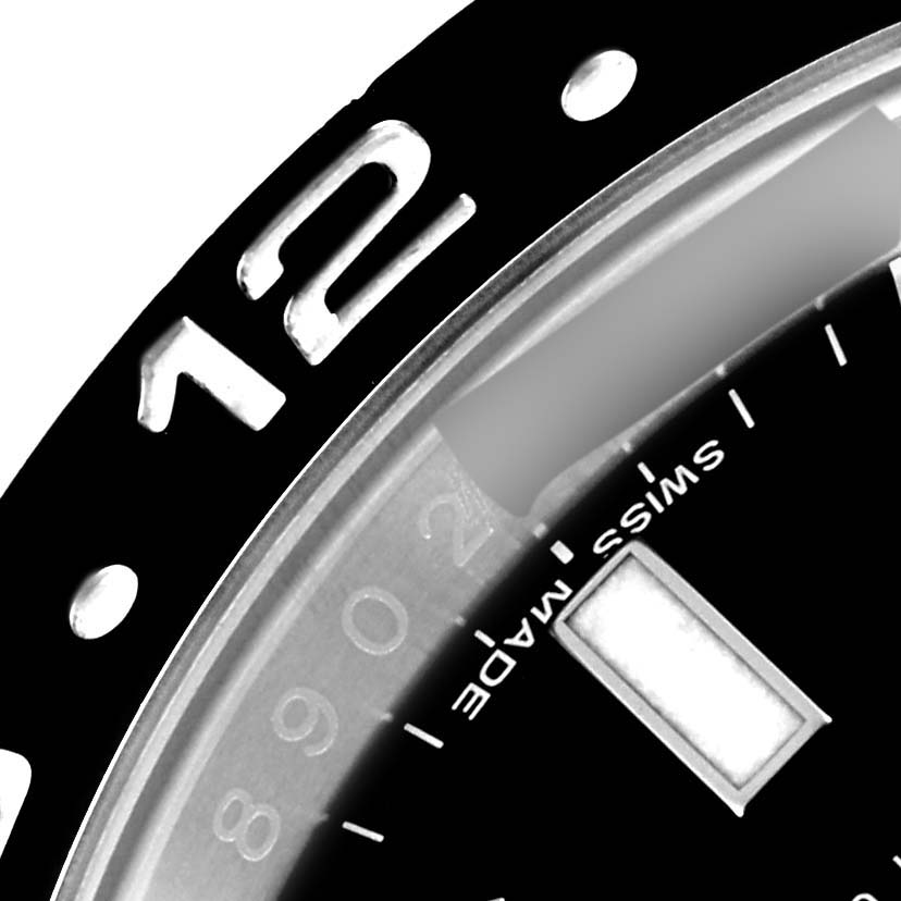 The image shows a close-up of the bezel, part of the dial, and the "Swiss Made" label on a Rolex GMT-Master 116710 Men's Stainless Steel Black Dial 116710 Men's Stainless Steel Black Dial watch.