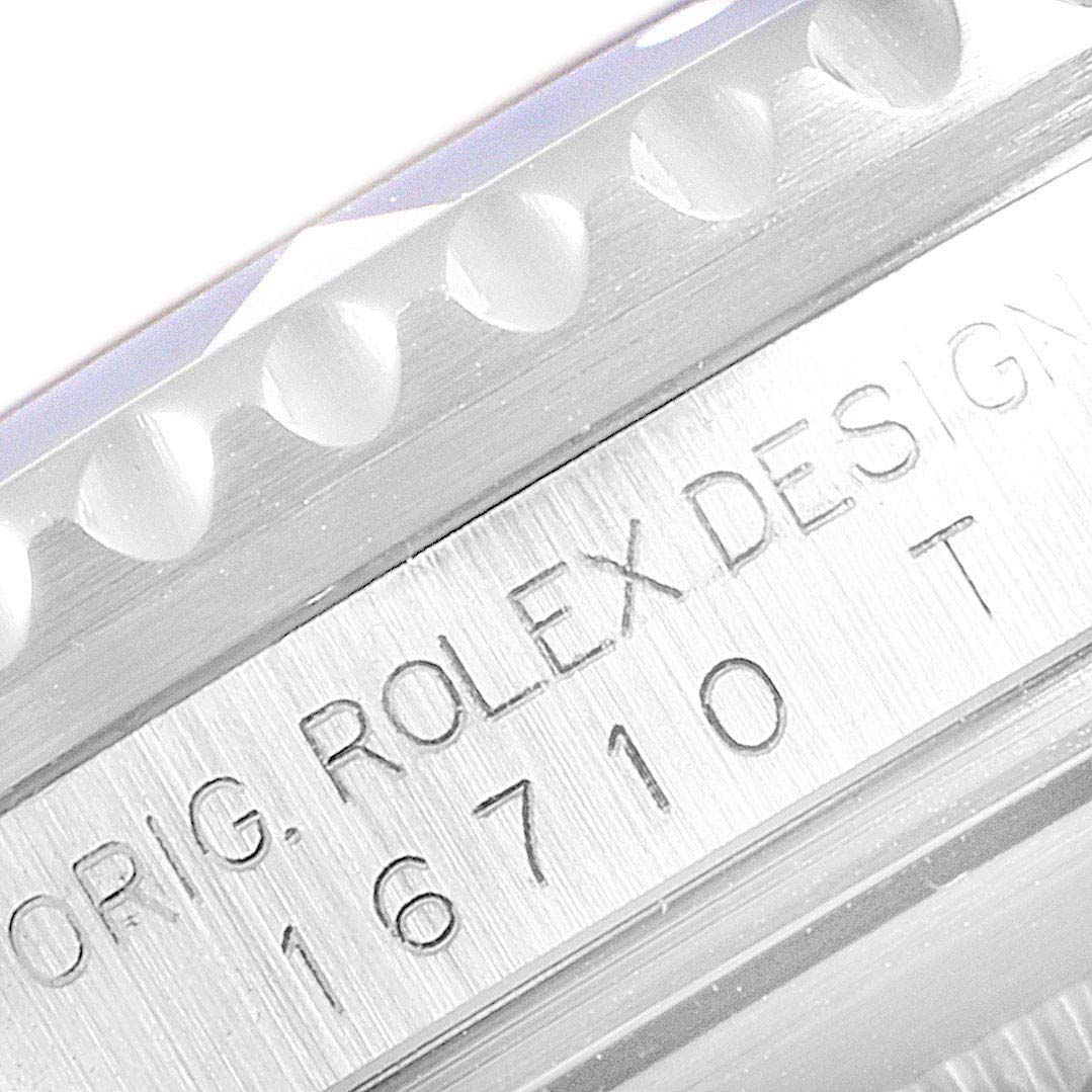 This close-up shows the side of a Rolex GMT-Master 16710 Men's Stainless Steel Black Dial 16710 Men's Stainless Steel Black Dial watch, highlighting engravings with the model number 16710.