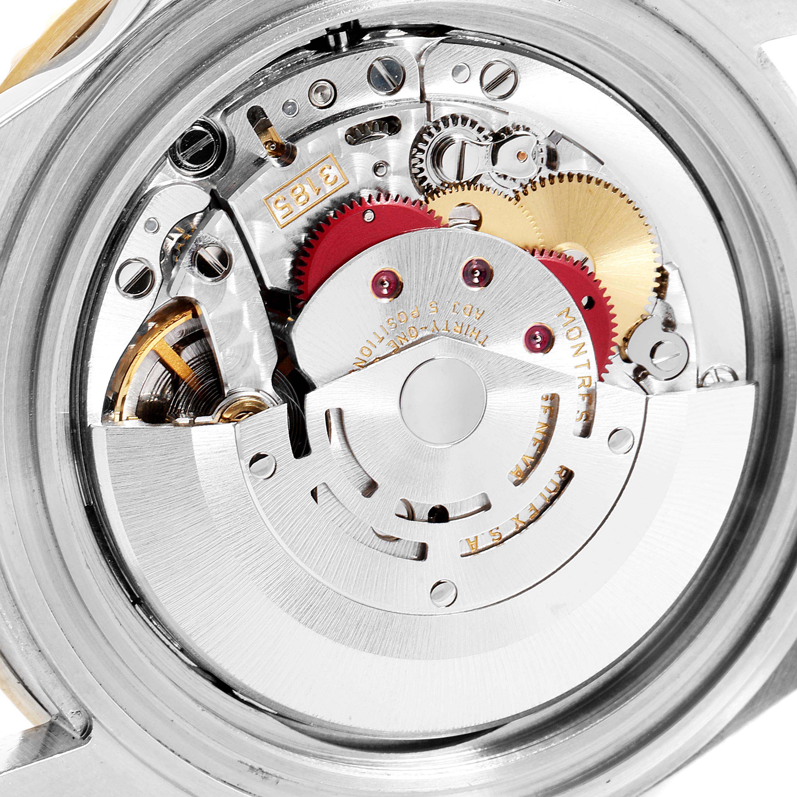 This image shows the intricate internal movement components of a Rolex GMT-Master 16713 Men's Steel and Gold (two tone) Brown Dial 16713 Men's Steel and Gold (two tone) Brown Dial watch from a close-up angle.