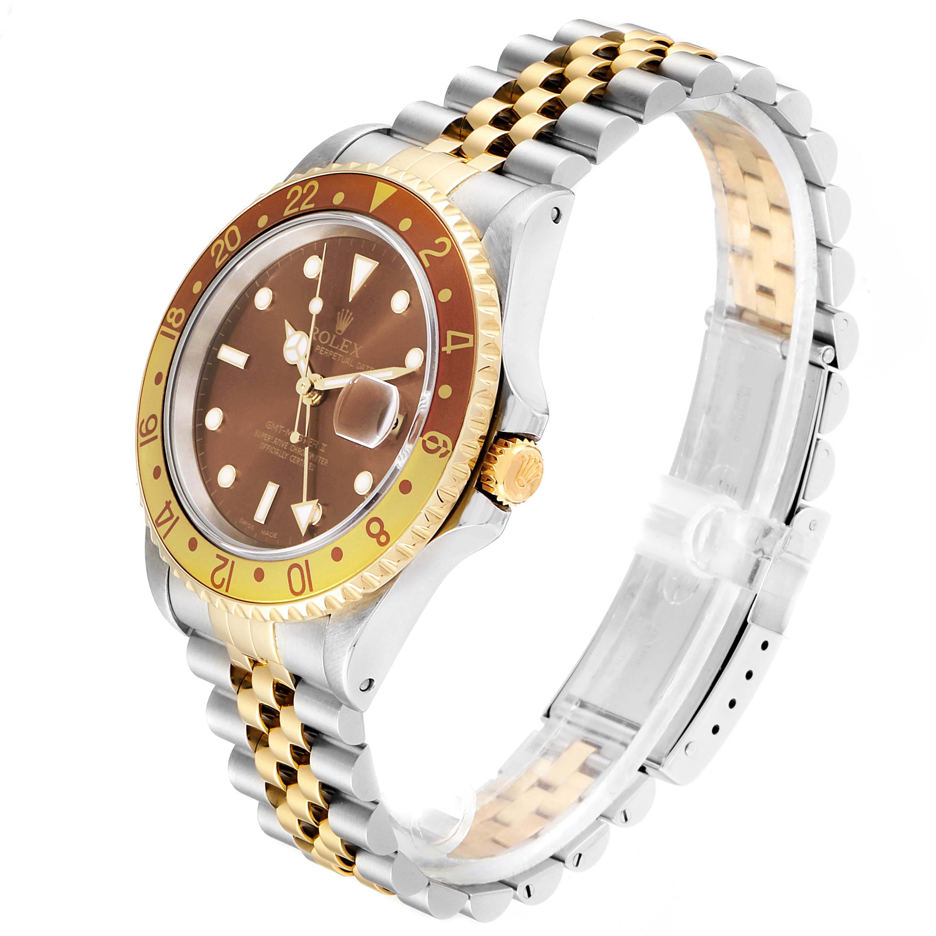 The Rolex GMT-Master 16713 Men's Steel and Gold (two tone) Brown Dial 16713 Men's Steel and Gold (two tone) Brown Dial watch is displayed at a slight angle, showing the face, bezel, crown, and Jubilee bracelet.