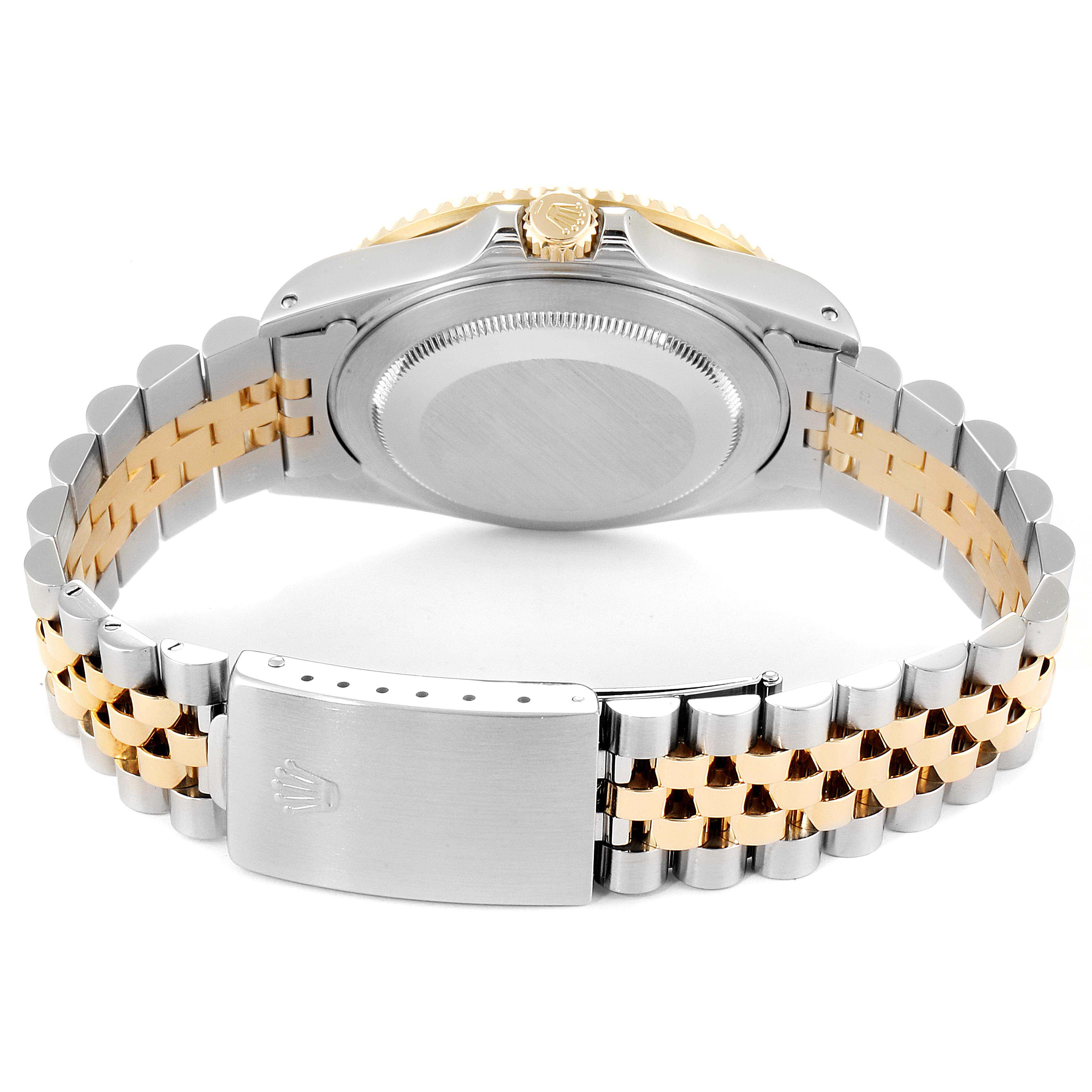 The image shows the backside and bracelet clasp of a Rolex GMT-Master 16713 Men's Steel and Gold (two tone) Brown Dial 16713 Men's Steel and Gold (two tone) Brown Dial watch, highlighting the jubilee bracelet and crown logo.